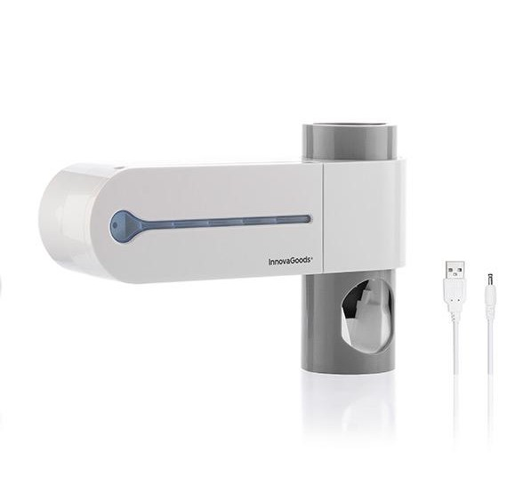Dispensador de pasta de dientes blanco y gris con dos cables USB. El producto tiene el logo InnovaGoods.