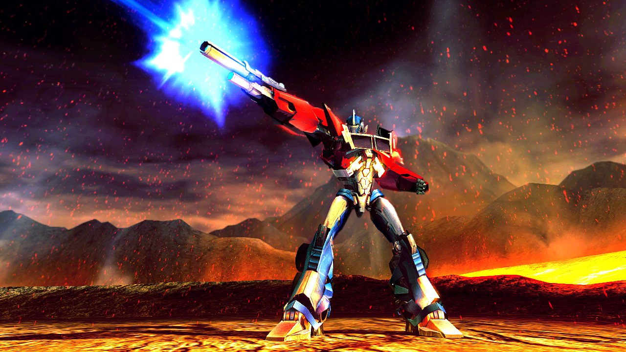 Optimus Prime feuert einen blauen Energiestrahl ab, der in einer feurigen Landschaft steht.