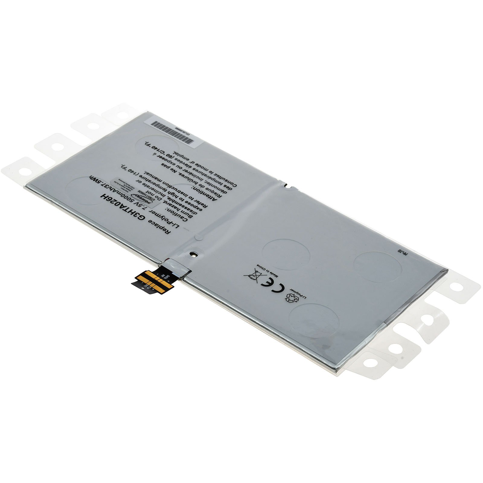 Batería de portátil dentro de plástico transparente. Batería plateada con etiquetas, conectores y una etiqueta.