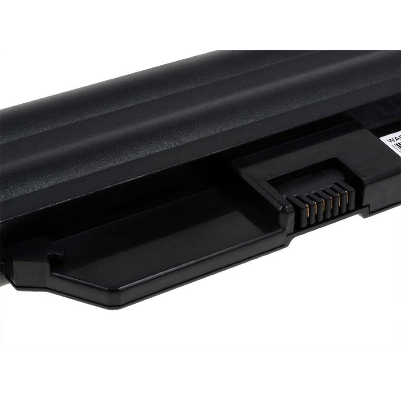 Primer plano del conector de la batería del portátil, plástico negro, con pines.