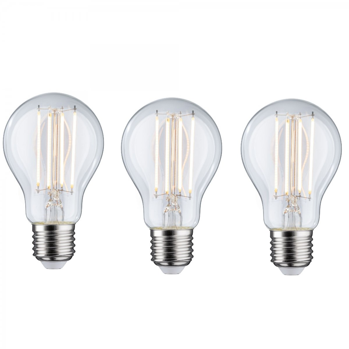 Trzy przezroczyste żarówki z widocznymi włóknami na białym tle.