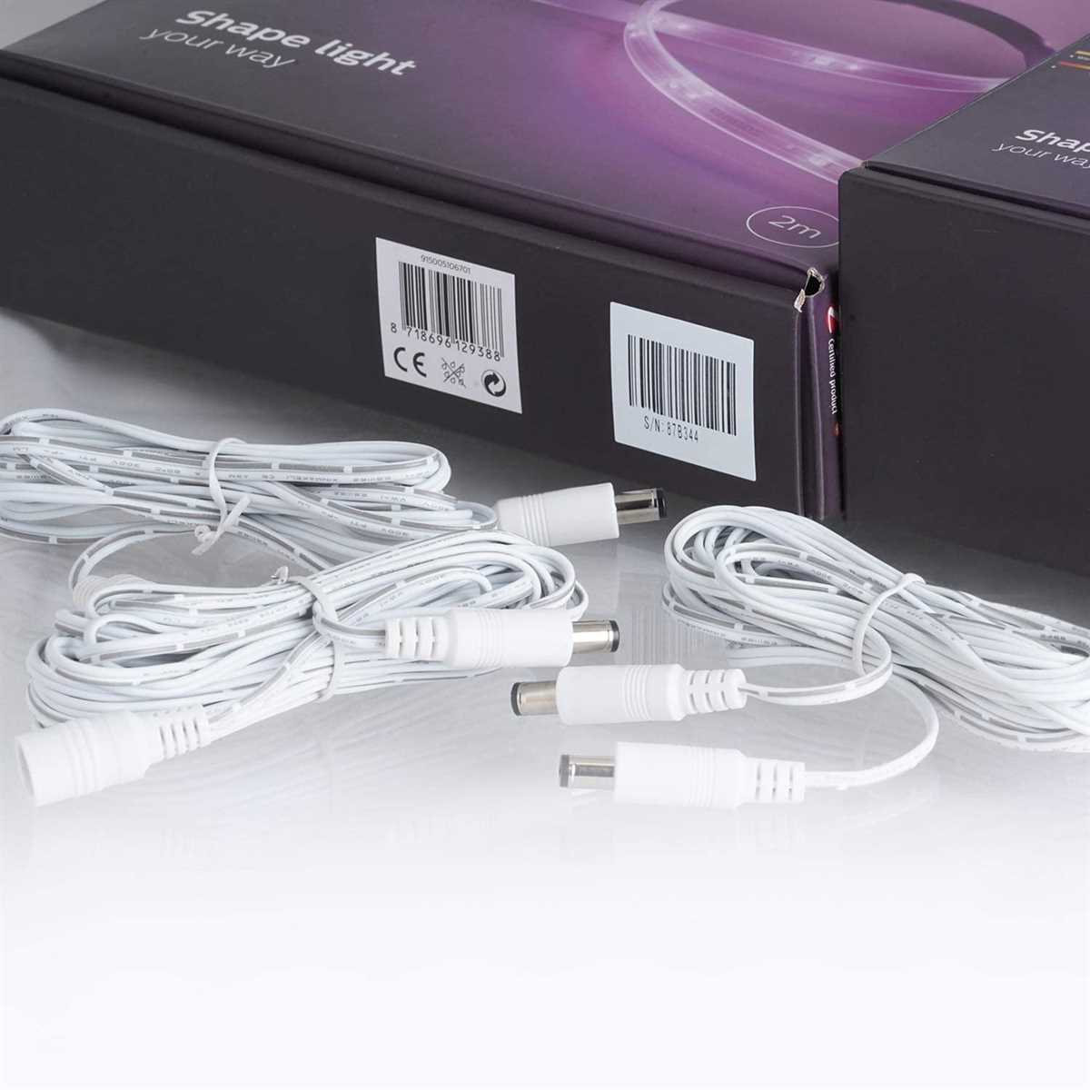 Shape Light Kit, Kabel und Anschlüsse. Schwarze Box mit Text oben. Weißer Hintergrund, helle Beleuchtung.