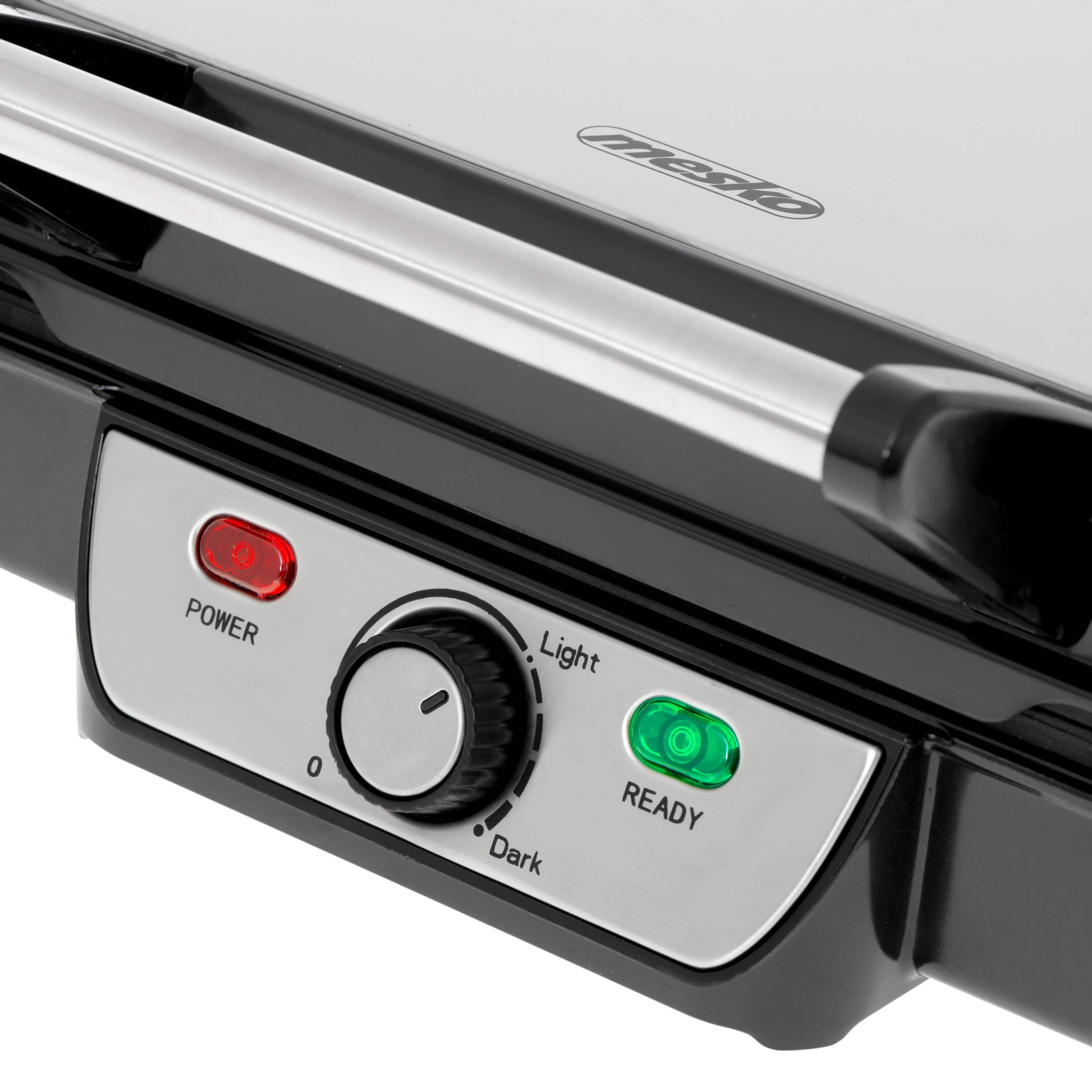 Nahaufnahme eines schwarz-silbernen Grills mit roten und grünen Kontrollleuchten.