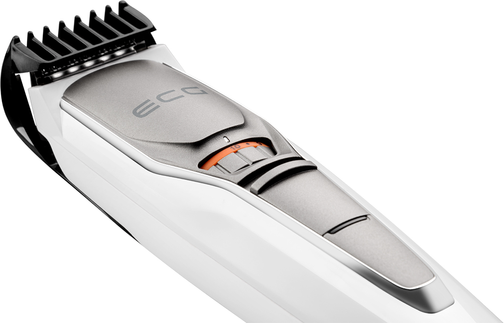 Zbliżenie białej i srebrnej maszynki do brody. Trymer ma szare pokrętło regulacji.