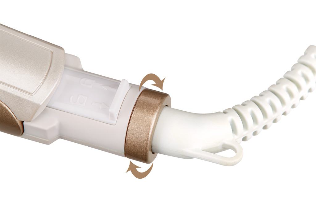 Zbliżenie lokówki z obracającymi się częściami i białym przewodem.