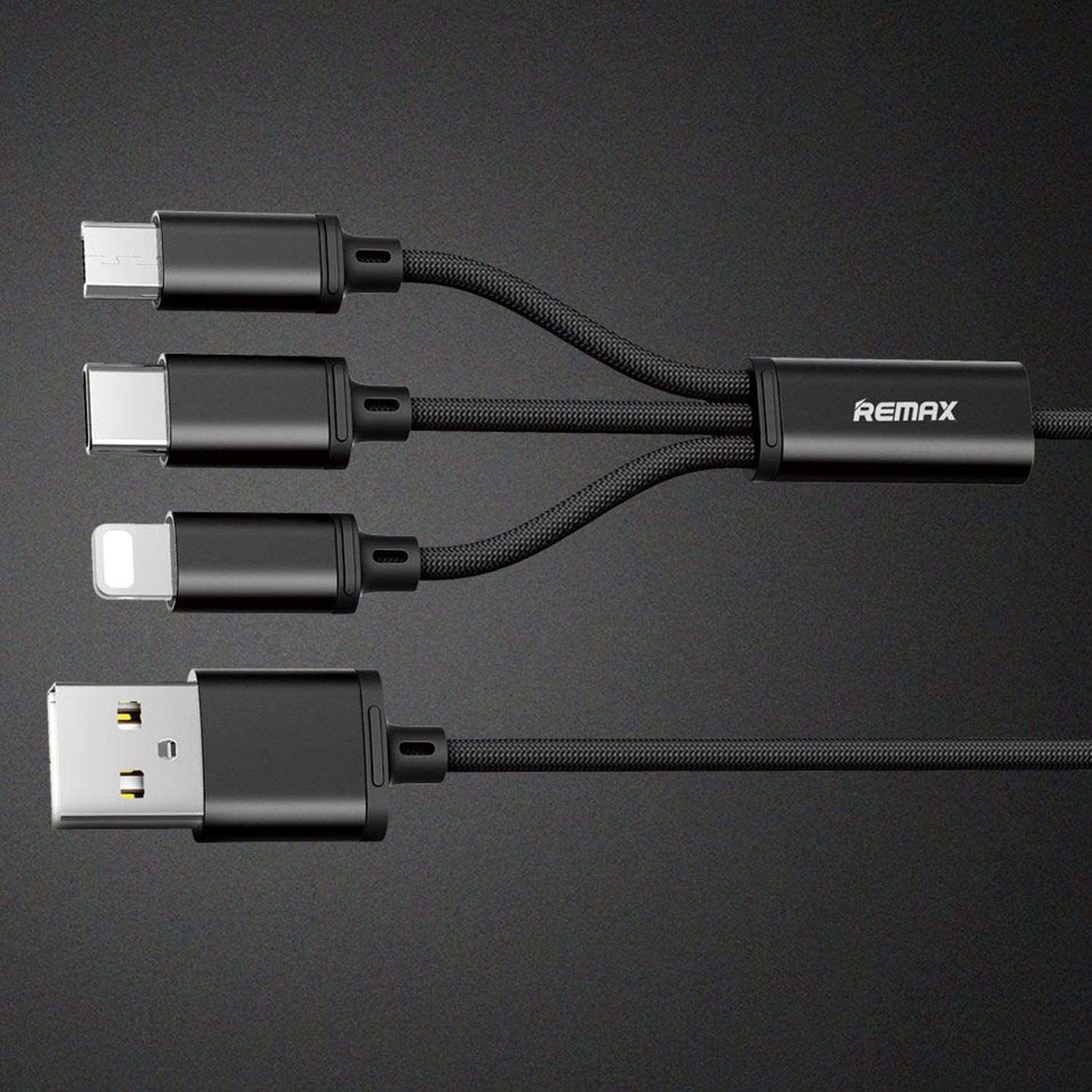 Schwarzes Multi-Connector-Kabel mit USB-C, USB-C, Lightning und USB-A-Anschlüssen auf dunklem Hintergrund.