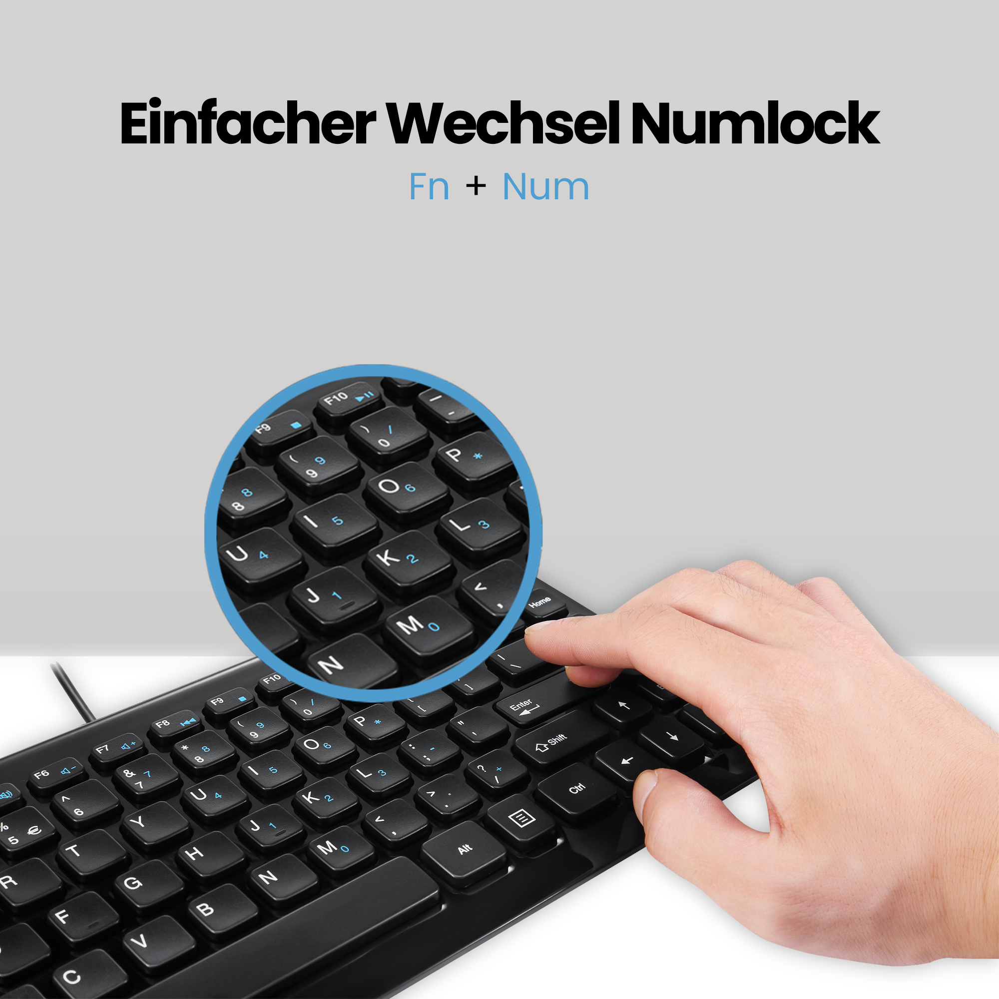 Un primo piano di una tastiera nera con tasti bianchi. Un cerchio blu evidenzia i tasti numerici.