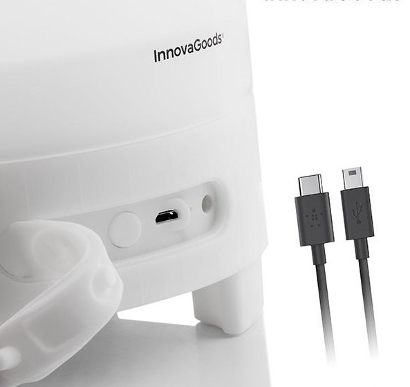 Weißes Gerät mit USB-Anschlüssen und zwei Ladekabeln. InnovaGoods-Logo sichtbar. Weißer Hintergrund.