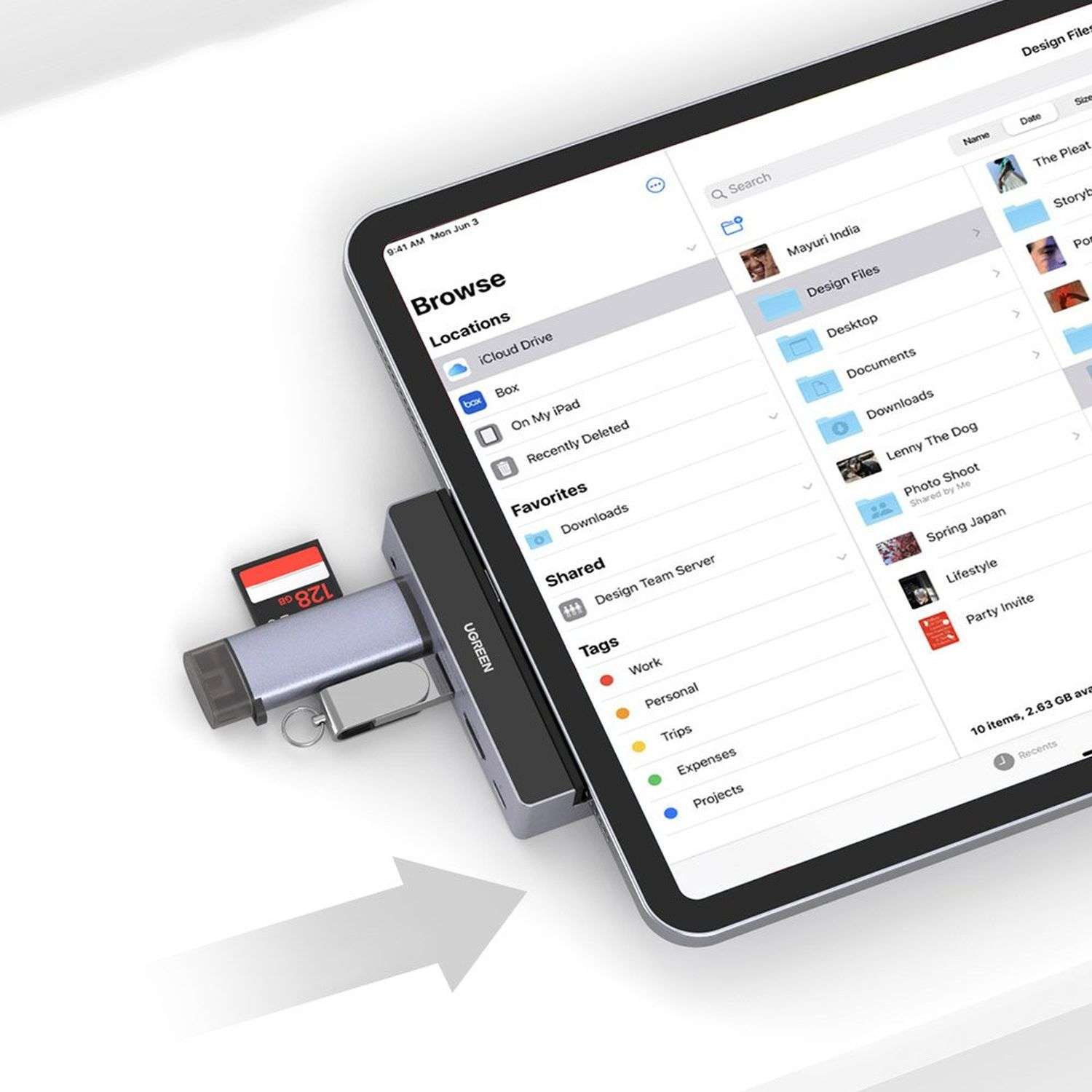 Tablet with a hub and SD card. The screen shows a file browser. Gray and white background.