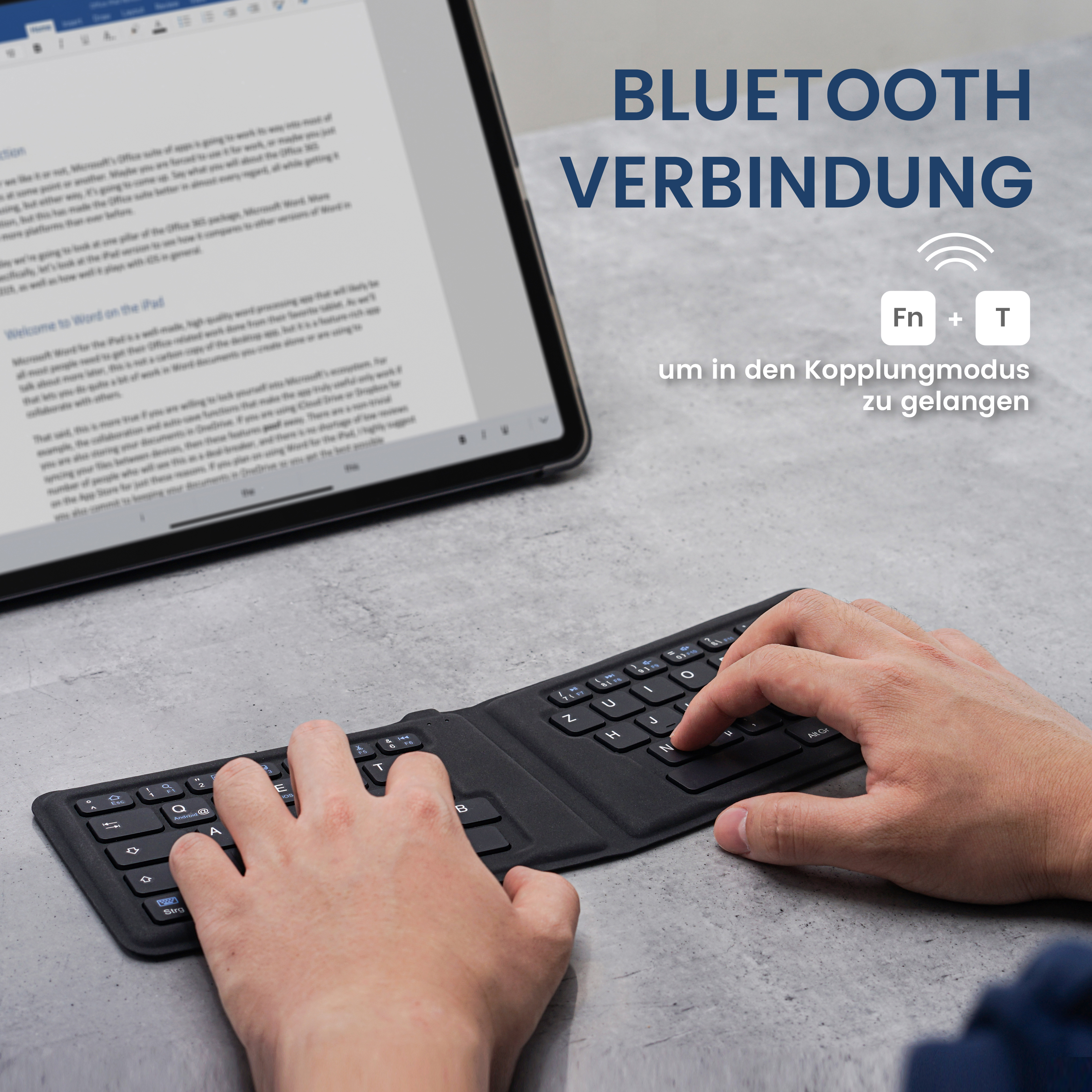 Hände auf Tastatur, Tippen auf einer schwarzen, faltbaren Tastatur, die über Bluetooth mit einem Tablet verbunden ist.