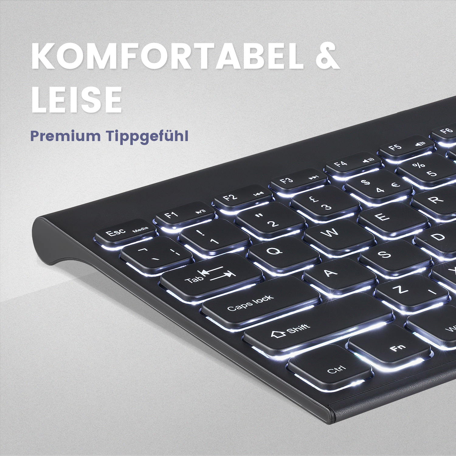 Schwarze beleuchtete Tastatur mit weiß beleuchteten Tasten. Text: 'Komfortabel & Leise', 'Premium Tippgefühl'.