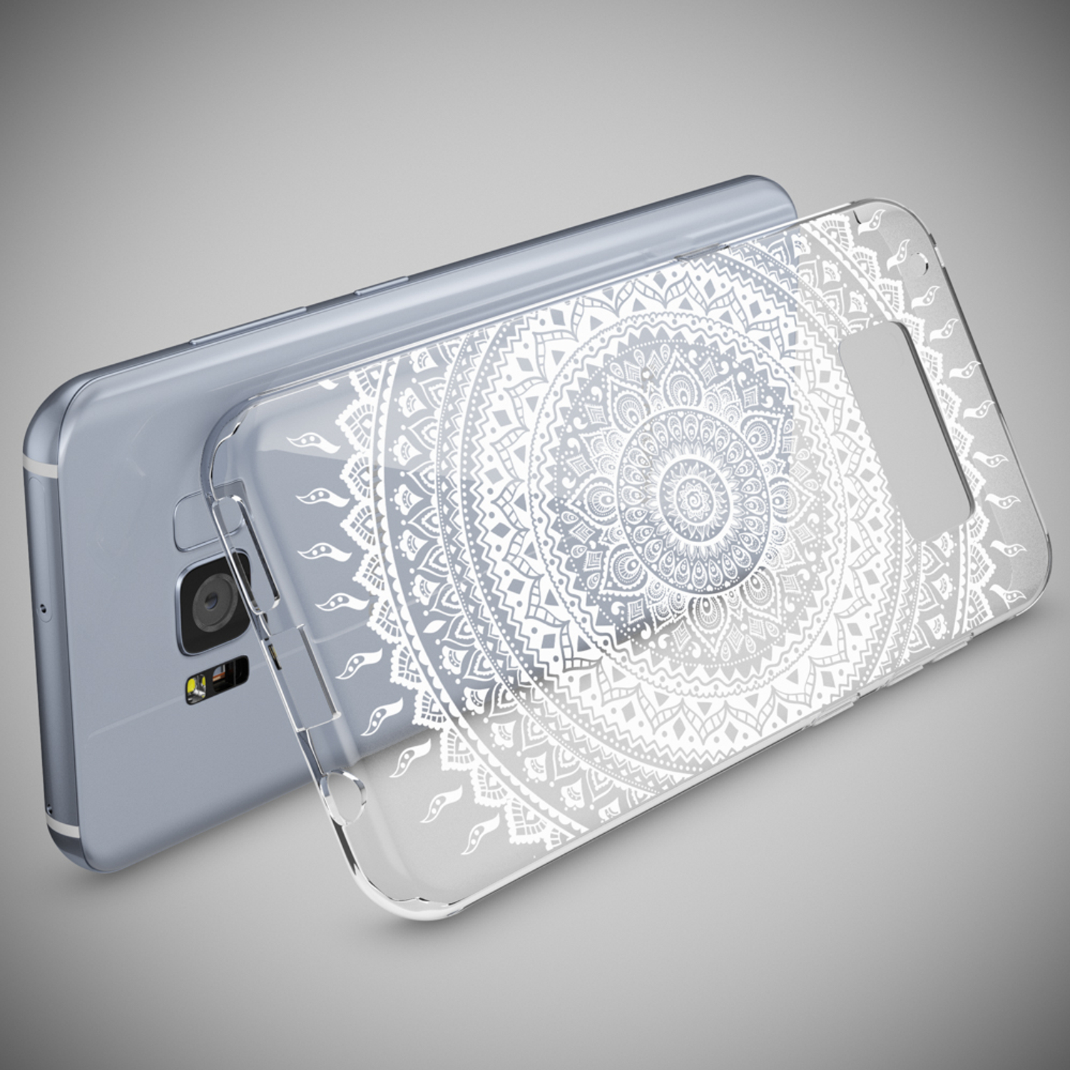 Funda de teléfono con diseño de mandala blanco sobre un teléfono plateado.