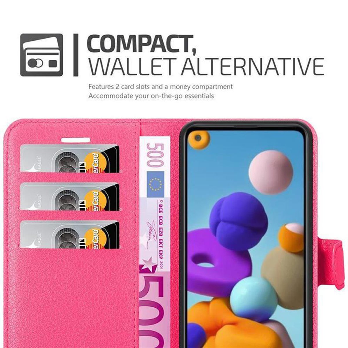 Portafoglio rosa per telefono con carte e denaro. Il telefono è nel portafoglio.