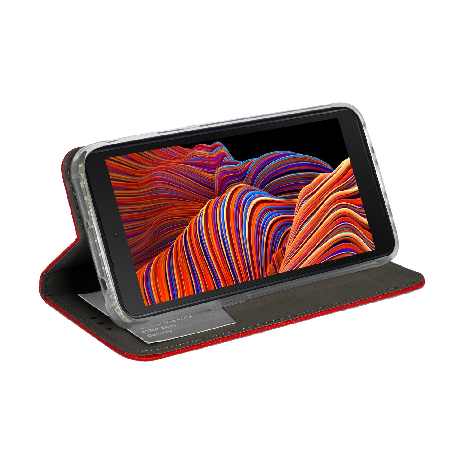 Offene Handyhülle mit Telefon. Die Hülle ist rot, das Telefon liegt auf einem Schreibtisch.