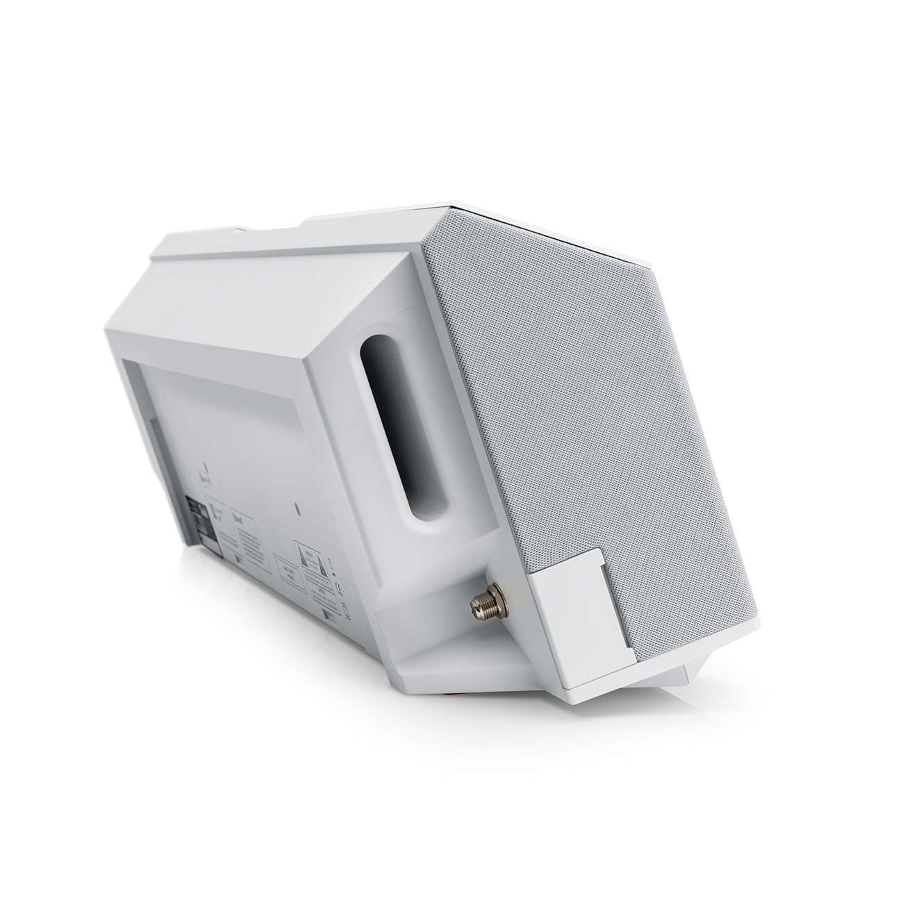 A white angled speaker with a gray mesh front. It is angled on a white surface.