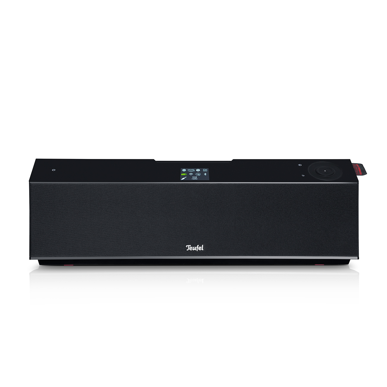 Schwarze Teufel Soundbar mit Display und einem Knopf, auf einer weißen Oberfläche platziert.