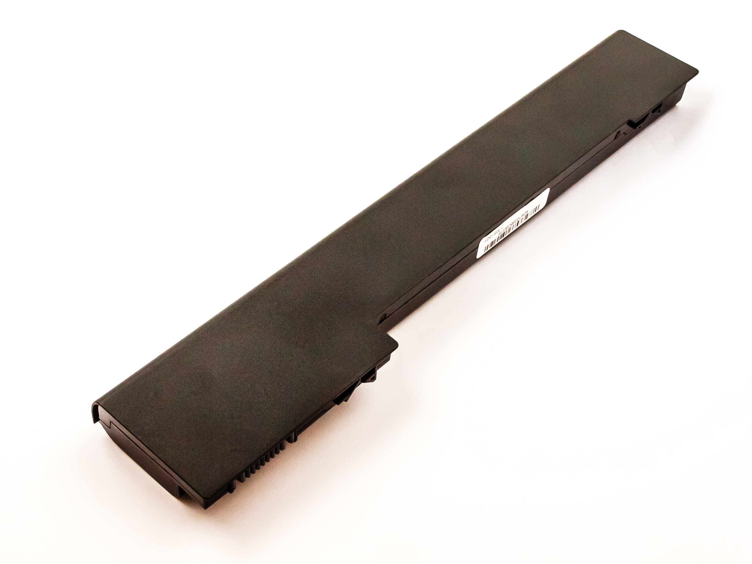 Lange, schwarze Laptop-Batterie auf weißer Oberfläche, von oben gesehen.