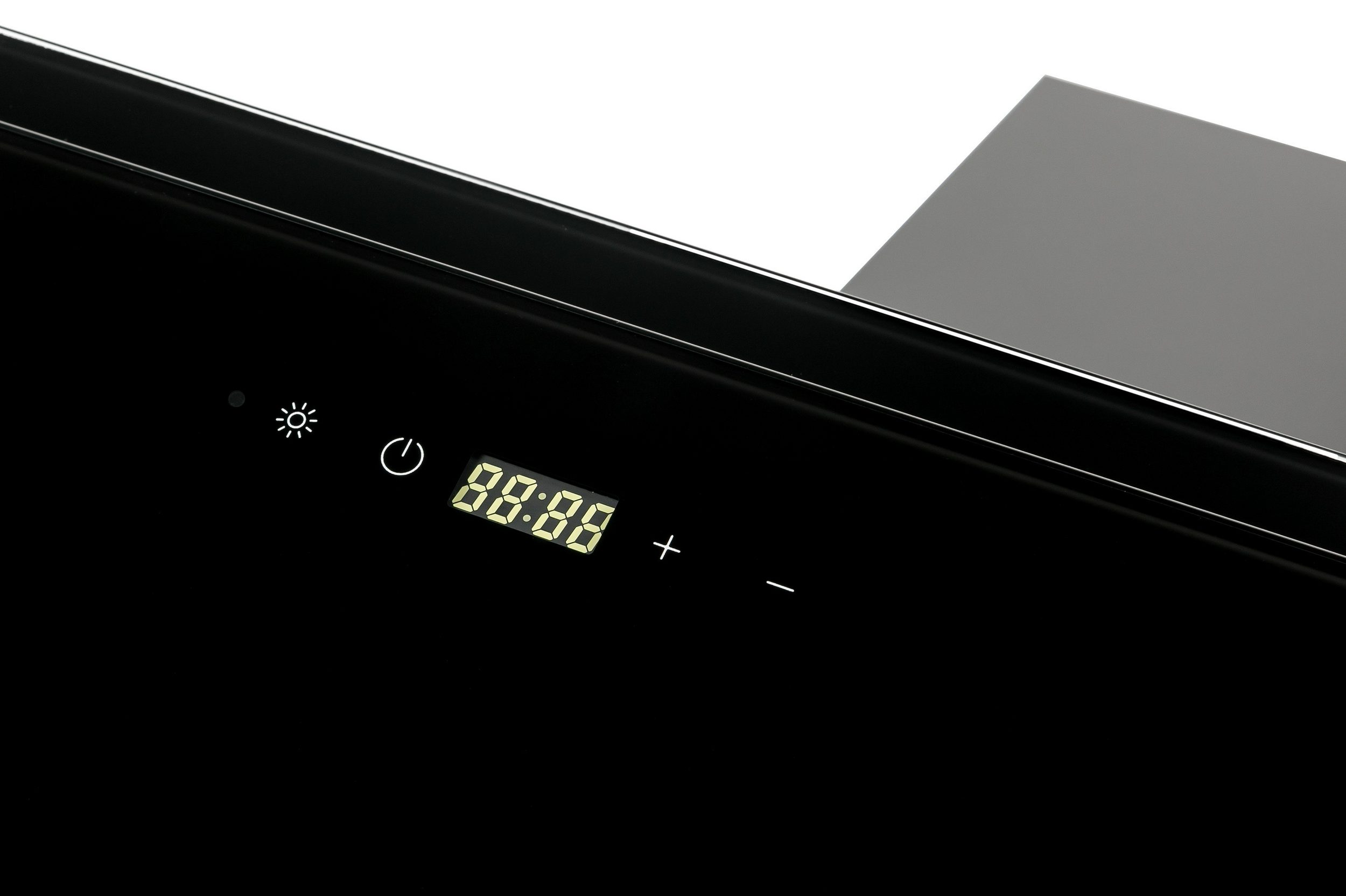 Ein schwarzes Gerät mit einer Digitaluhr, die '88:88' anzeigt. Es gibt Plus- und Minus-Tasten.