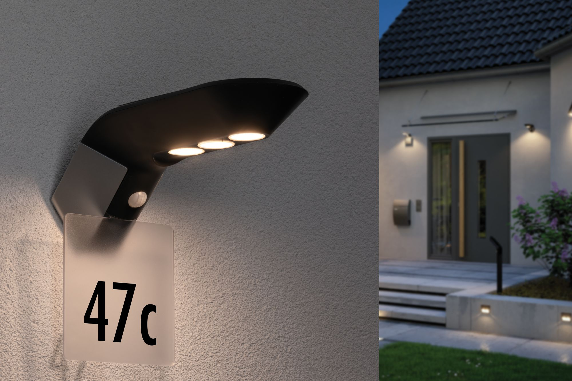 Zewnętrzna lampa ścienna z numerem '47c' i domem w tle.