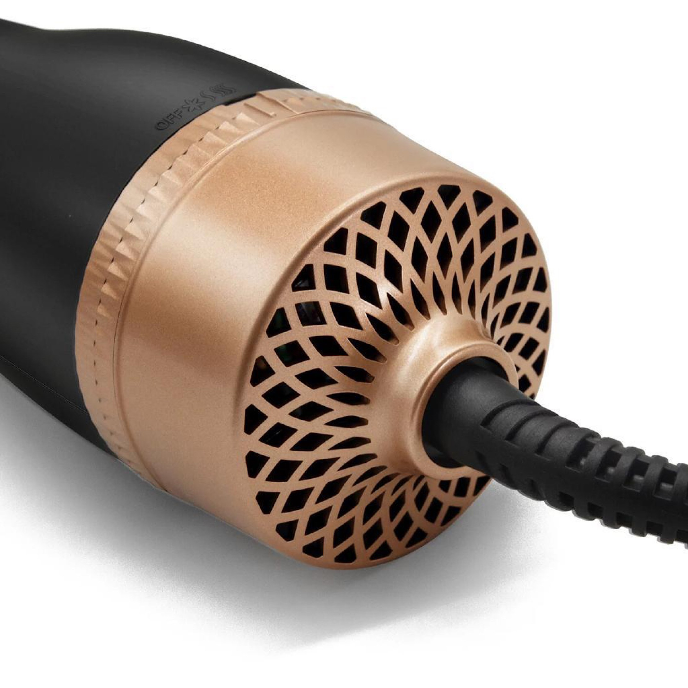 Zbliżenie czarnej i złotej suszarki do włosów z geometrycznym wzorem na dyszy.