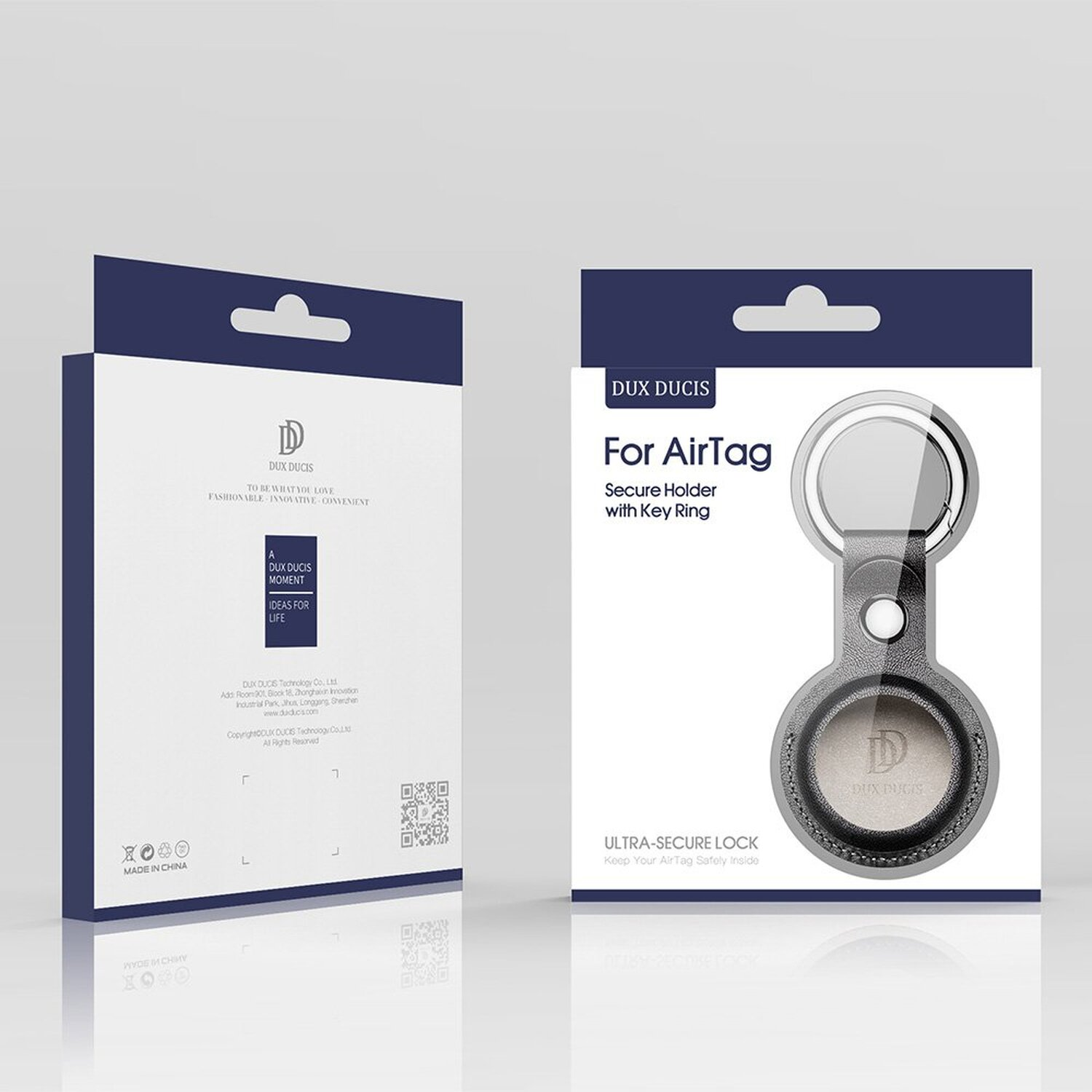 Verpackung für einen AirTag-Sicherheits-Halter mit Schlüsselring, mit Branding, in Grau und Weiß.
