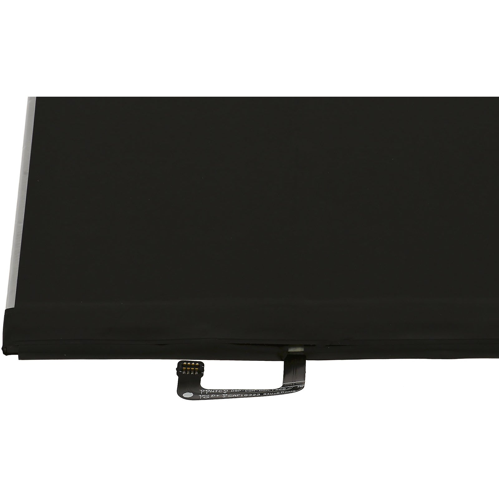 Una batería de tableta con un cuerpo negro, un conector y una etiqueta blanca. La batería está sobre una superficie blanca.