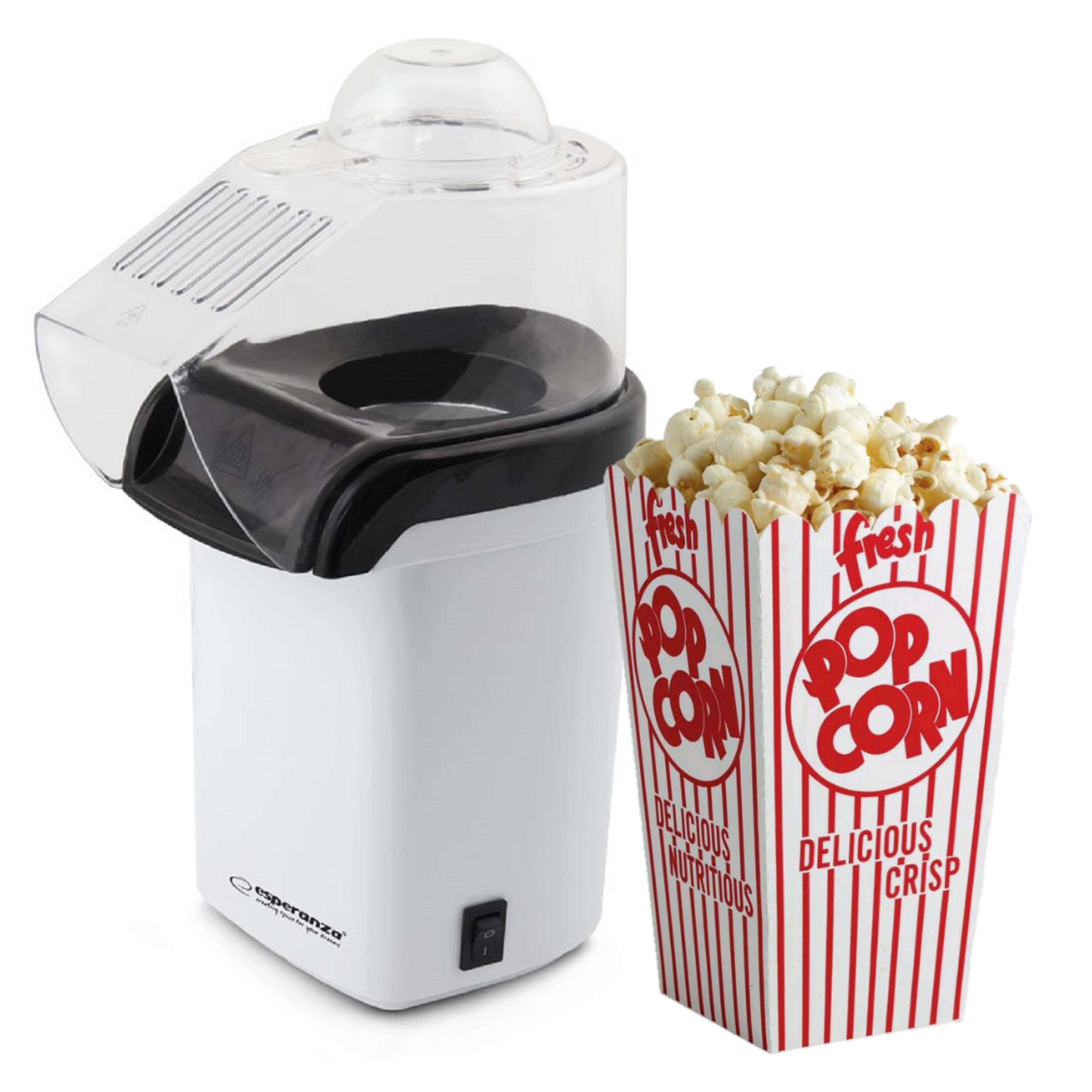 Weiße Popcornmaschine mit einem transparenten Deckel, neben einer Popcornbox mit roten Streifen und Text.