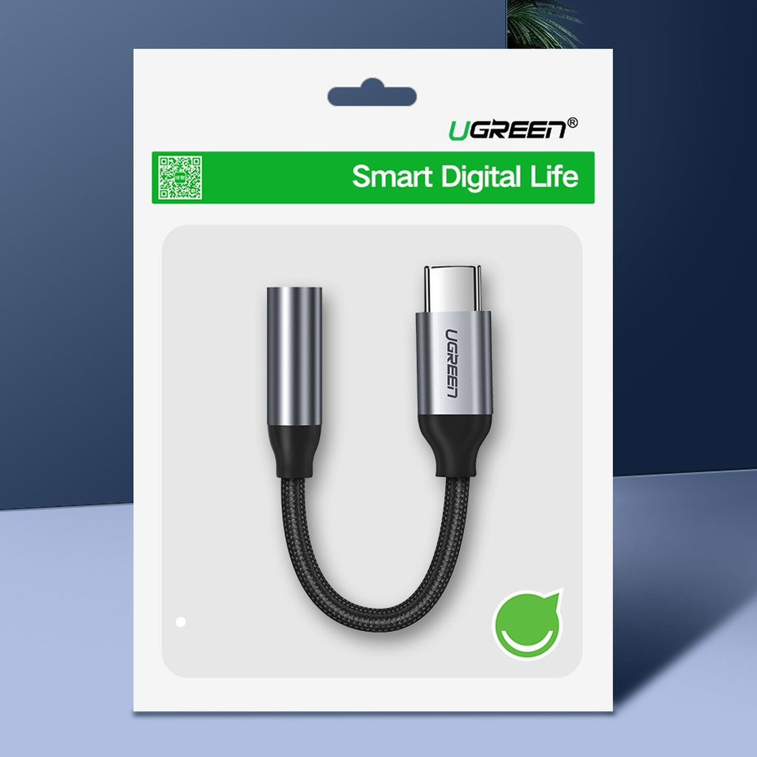 Adapter Ugreen w opakowaniu. Adapter ma USB-C i gniazdo 3,5 mm.