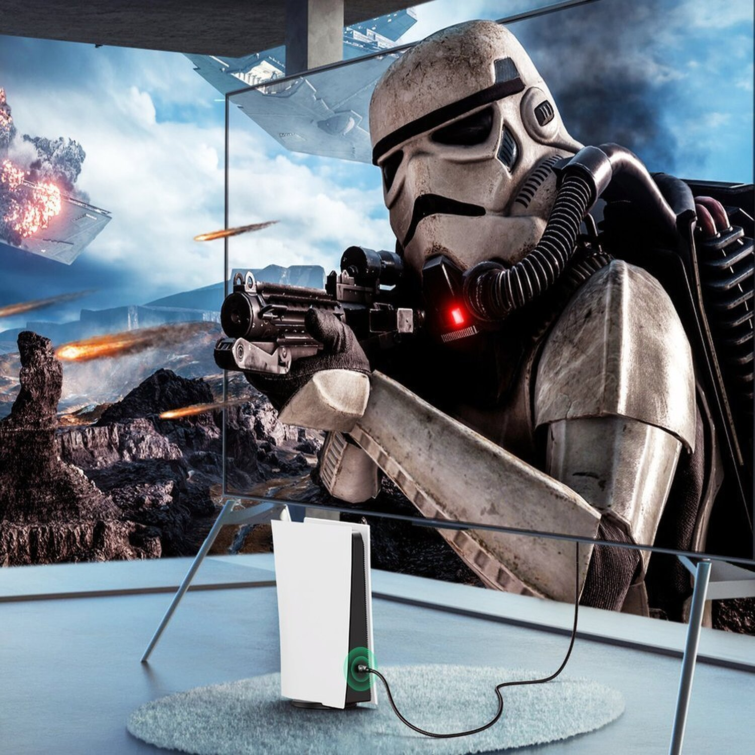 Szturmowiec celuje z blastera w scenę bitwy na telewizorze. Konsola na podłodze.