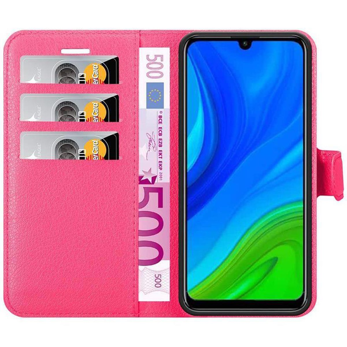 Custodia rosa per telefono con carte, contanti e un telefono. Il telefono a destra. Carte e contanti a sinistra.