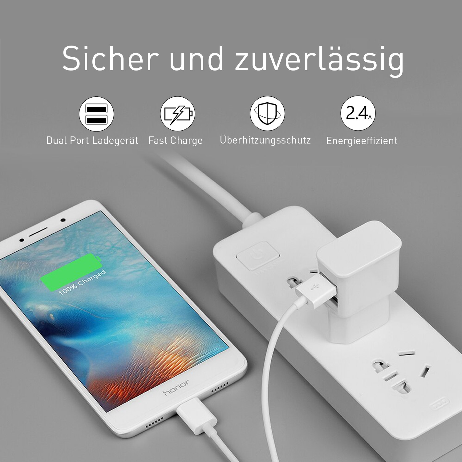 Telefon lädt an einer weißen Ladestation. Text lautet '100% geladen'. Weiße Steckdosenleiste.