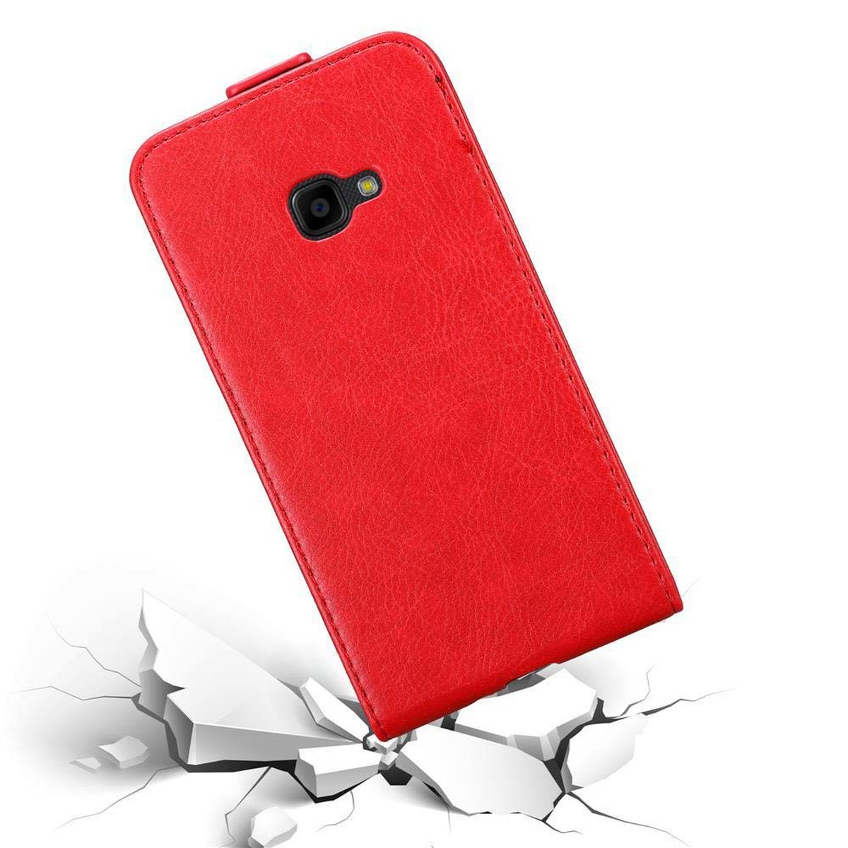 Custodia rossa per telefono su terreno incrinato.