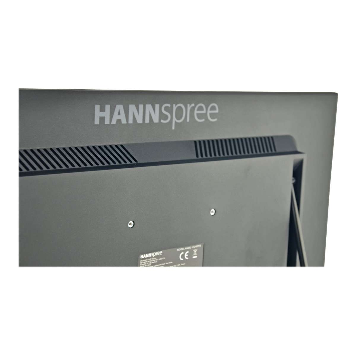 La parte trasera de un monitor Hannspree negro, mostrando el nombre de la marca y la información del modelo.