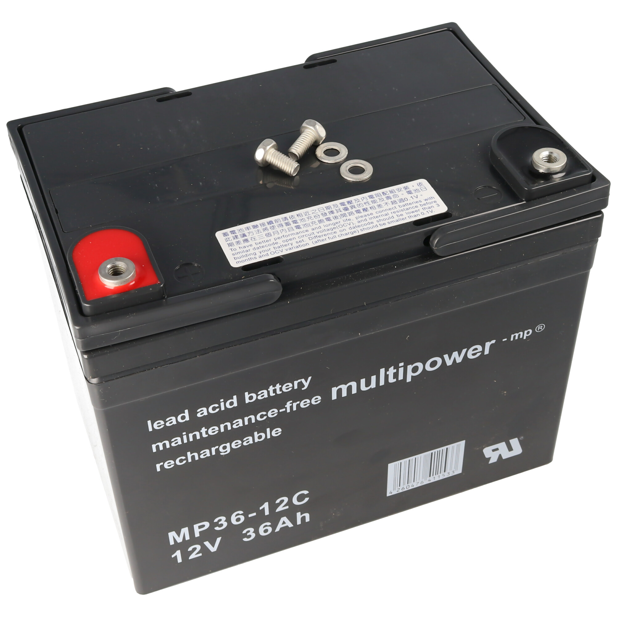 Grande batteria nera con viti, etichette e testo.