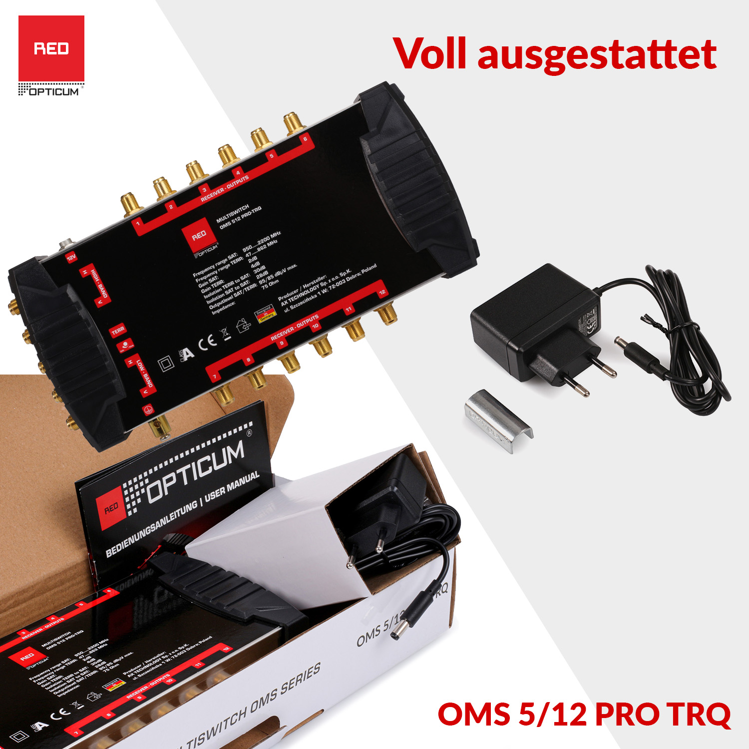 Schwarzes Gerät mit Etiketten und Zubehör. Roter und weißer Hintergrund.