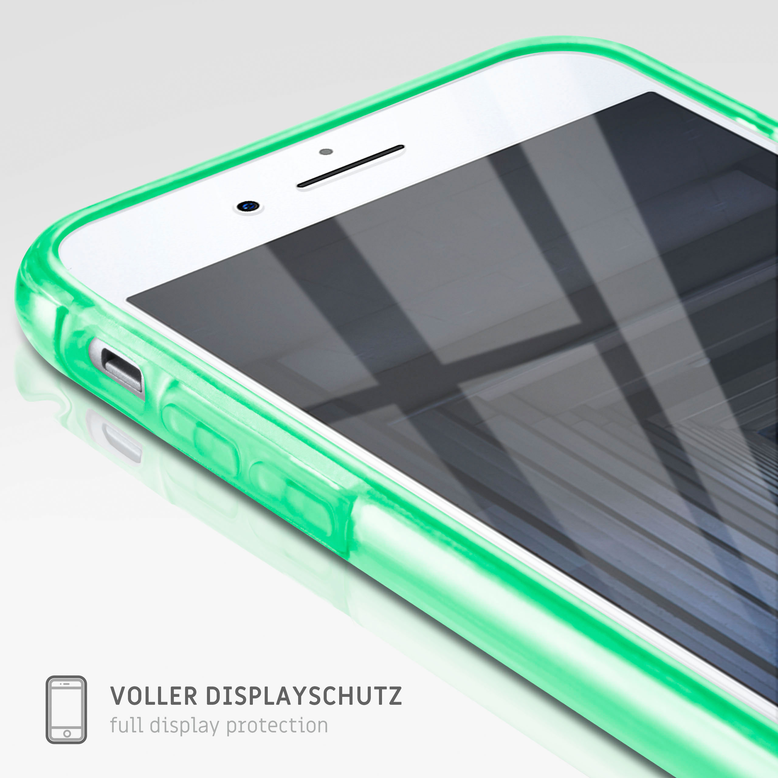 Weißes Telefon in einem grünen Gehäuse. Das Telefon ist zum Betrachter gedreht.