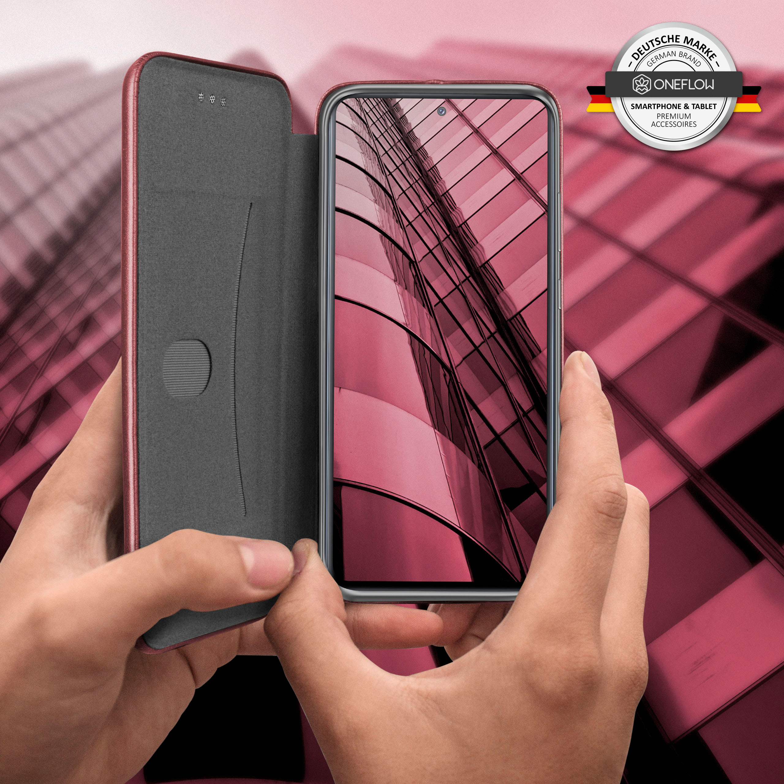 Handyhülle mit Telefon darin. Rote Kanten, grauer Innenraum und ein Gebäude, das sich auf dem Bildschirm spiegelt.
