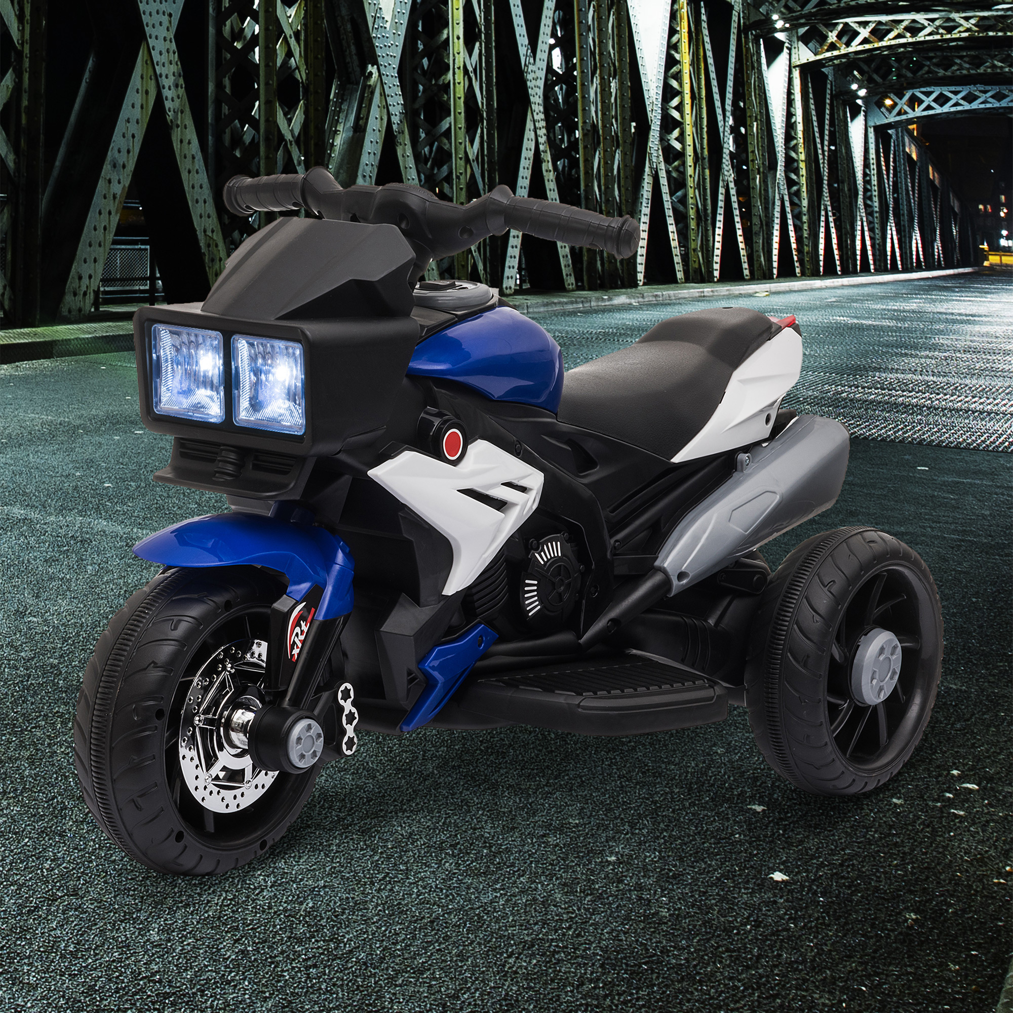 Moto giocattolo blu e nera con tre ruote, luci luminose e sfondo di ponte.
