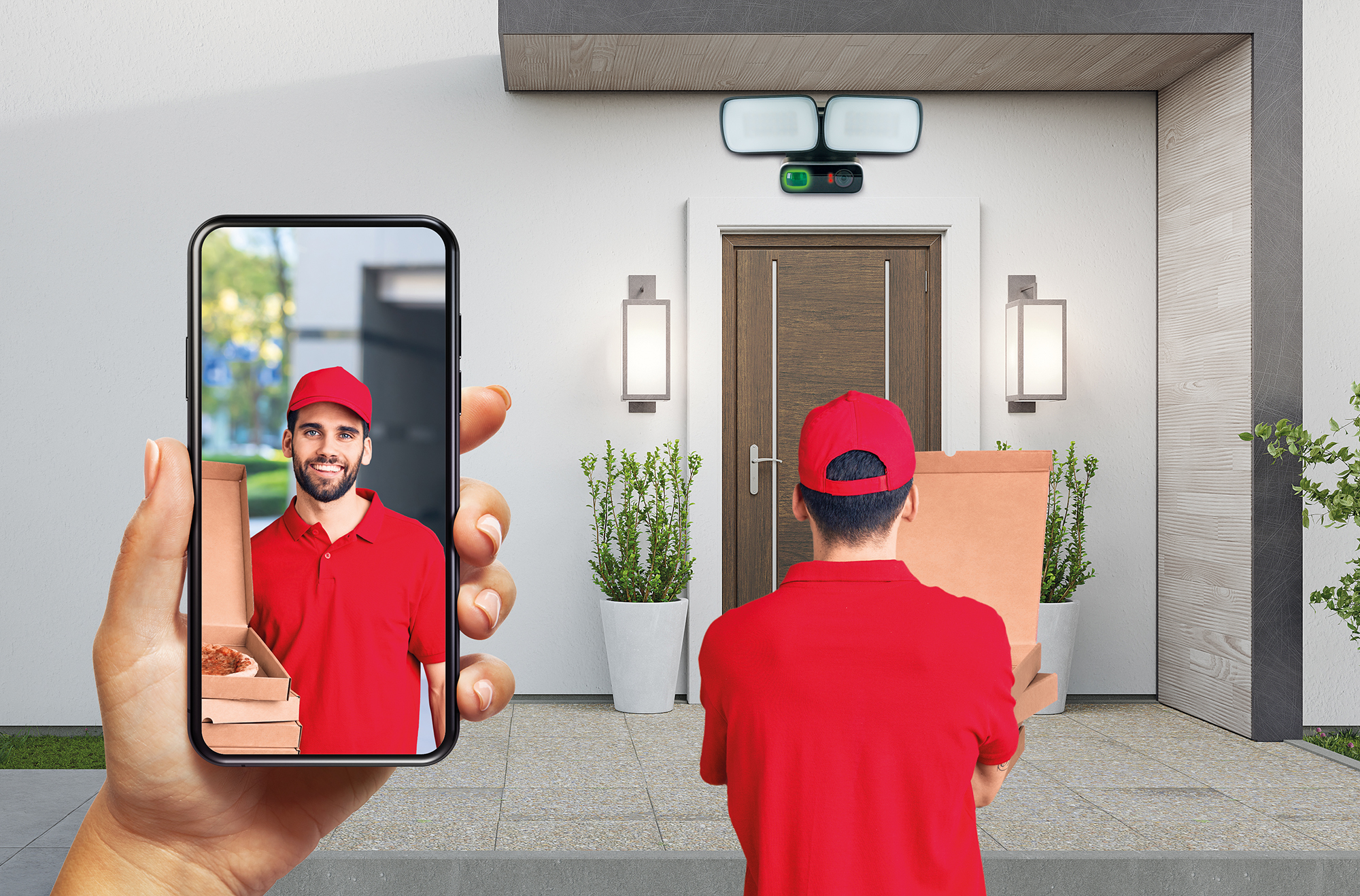 Eine Person hält ein Telefon, das einen Zusteller zeigt. Der Zusteller übergibt eine Schachtel.