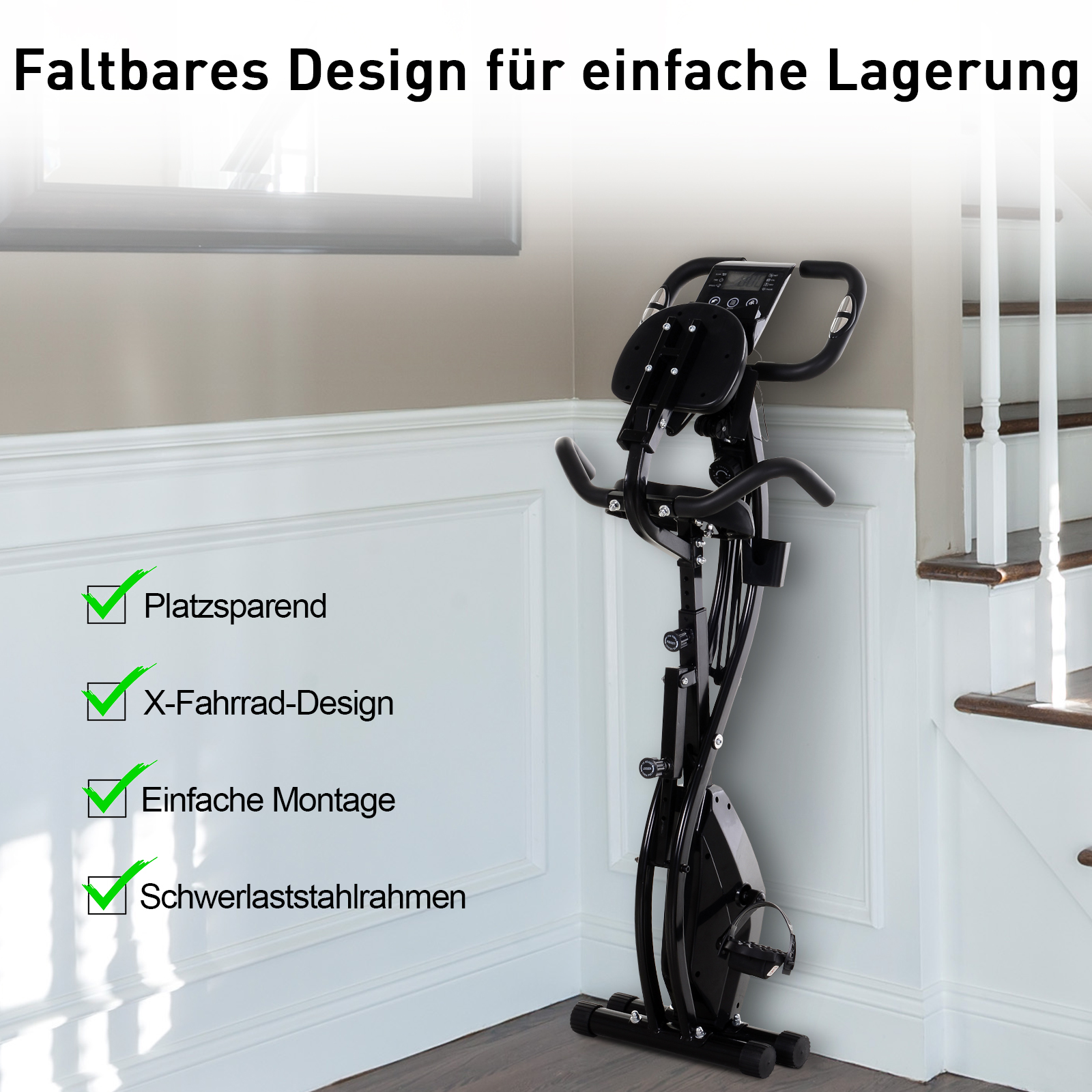 Schwarzes, zusammenklappbares Trainingsrad in einem Raum mit weißen Wänden und einer Treppe.