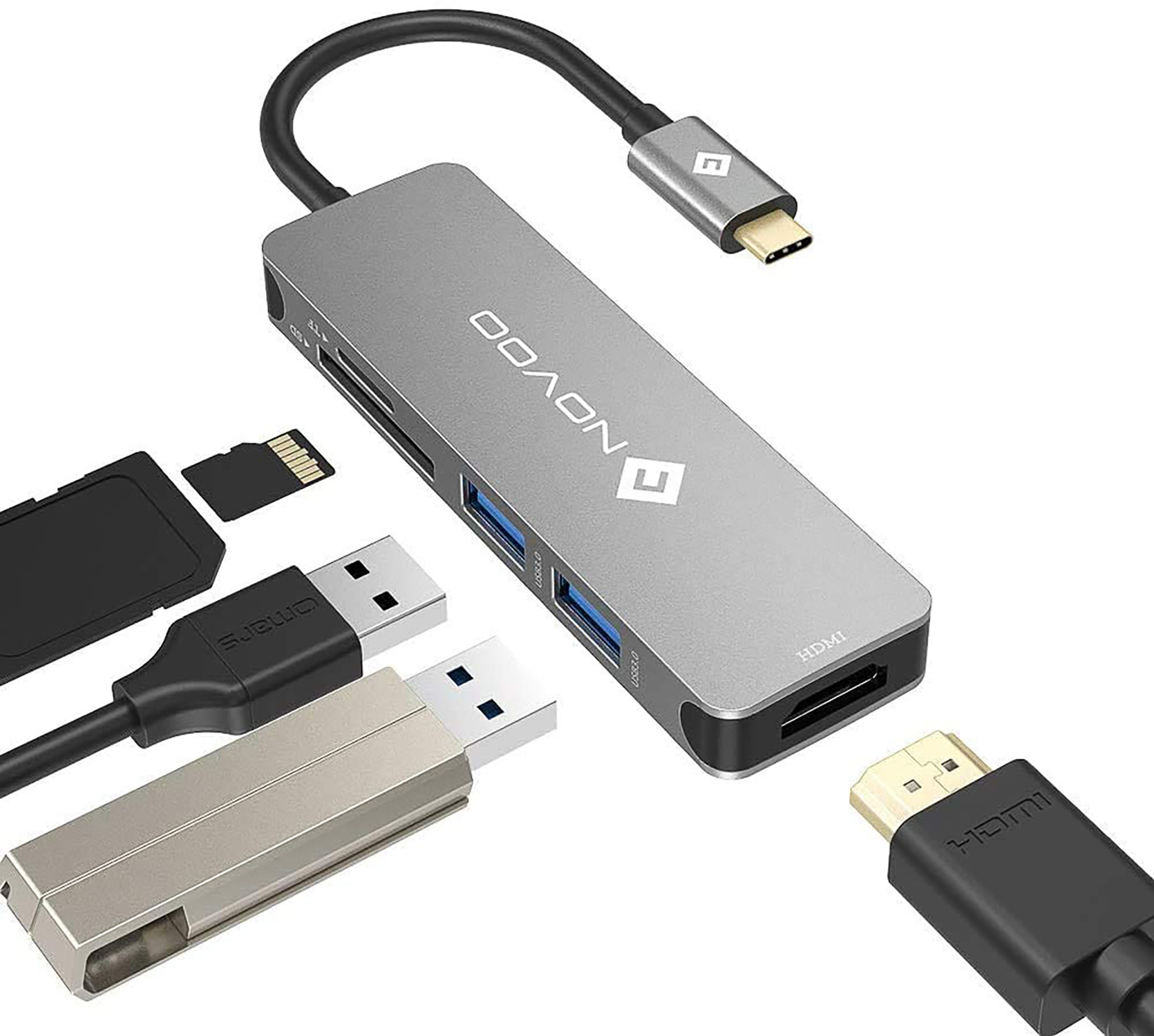 Silberner USB-Hub mit mehreren Anschlüssen und angeschlossenen Geräten.