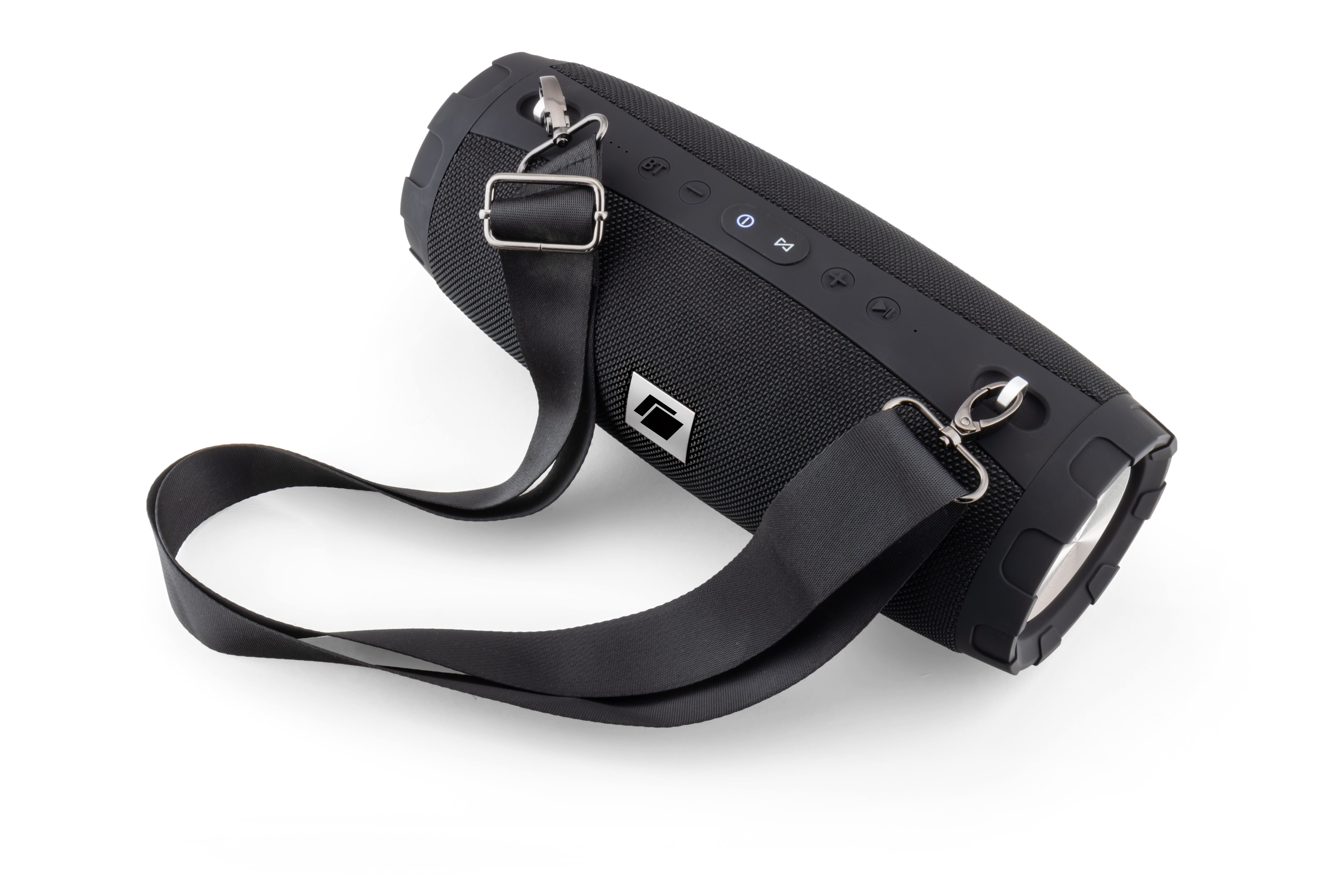 Haut-parleur portable noir avec sangle, sur une surface blanche.