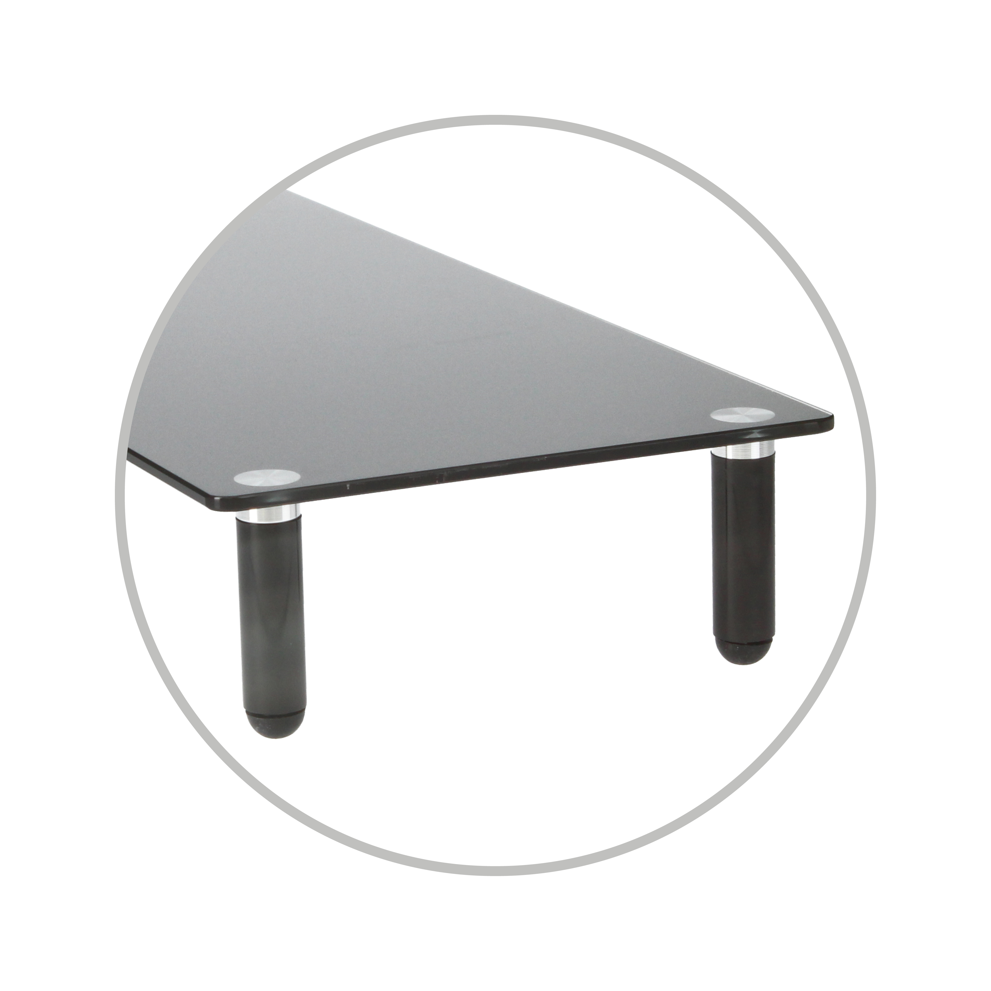 Primer plano de una mesa de vidrio negro, con patas oscuras, contorno circular.