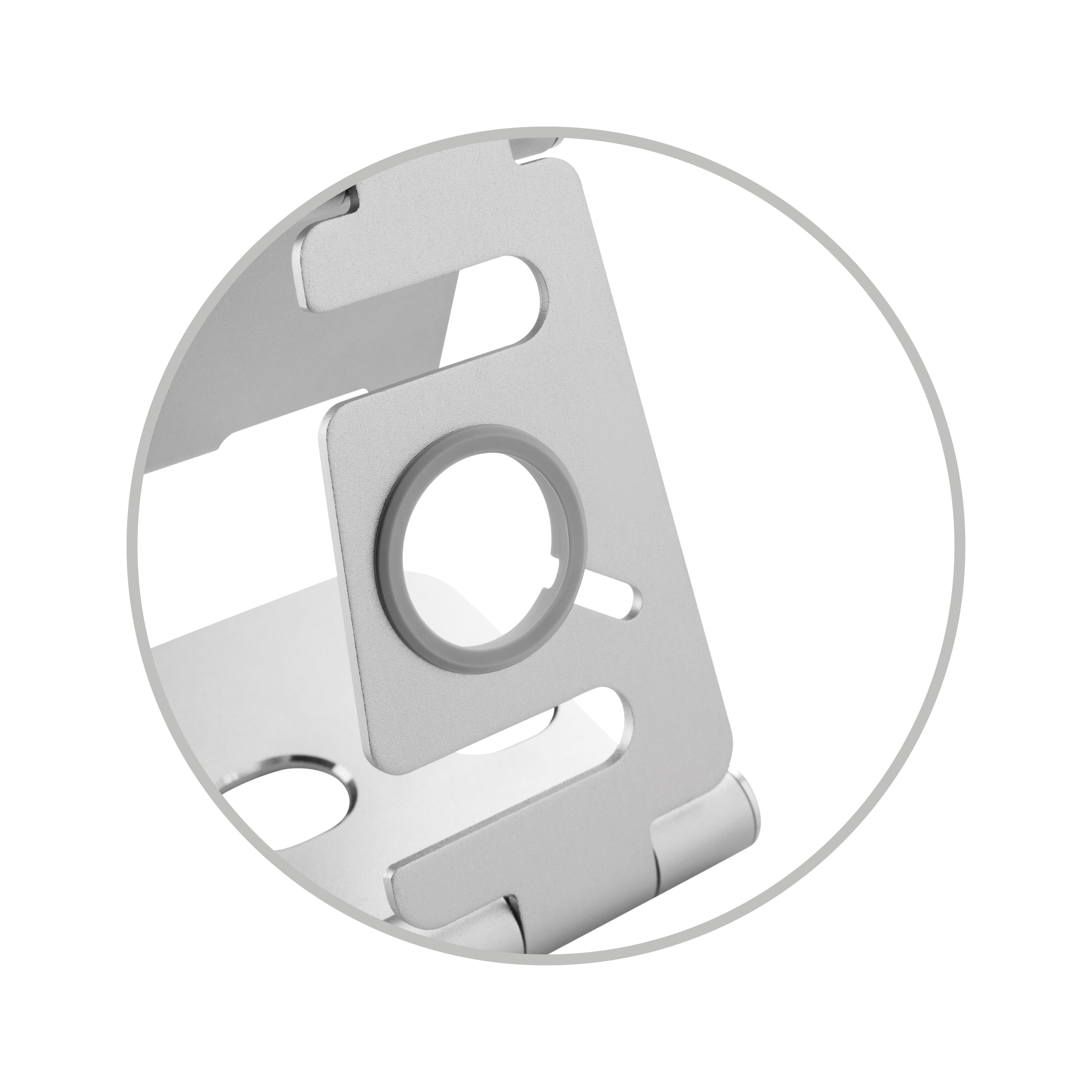 Primer plano de un soporte de teléfono plateado. El soporte tiene un recorte circular.