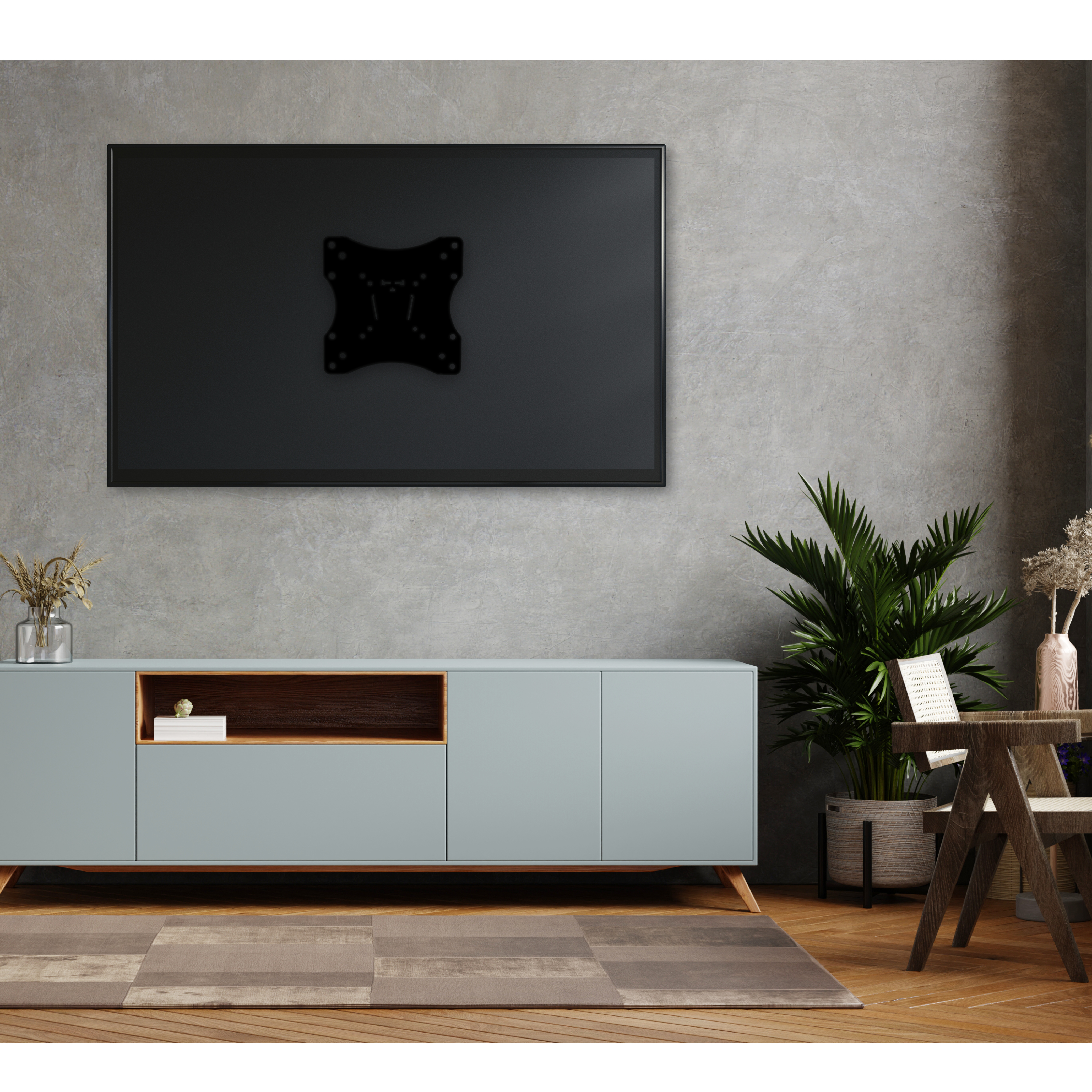Un televisor montado en una pared gris sobre un gabinete. Una planta y decoración están en el gabinete.