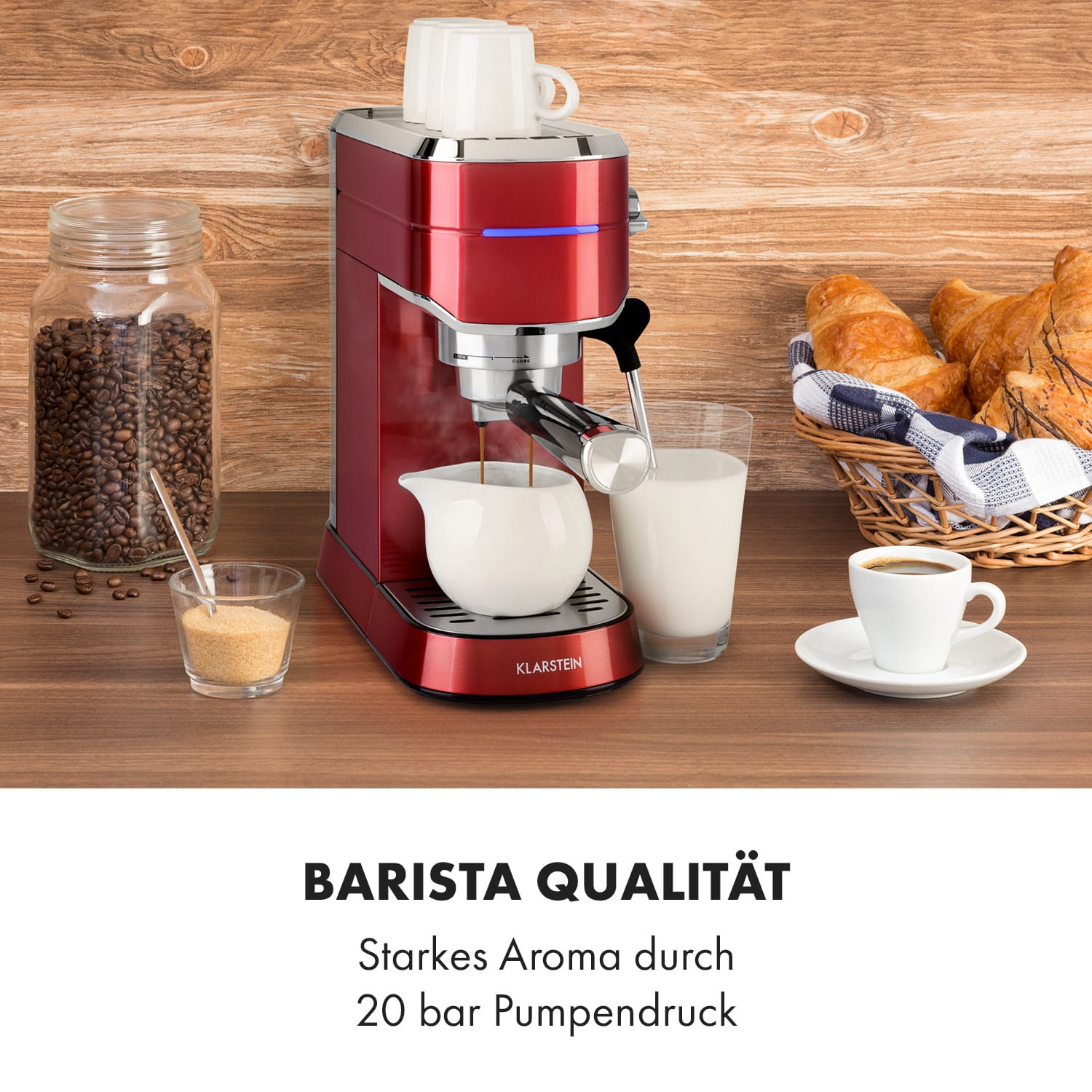 Rote Kaffeemaschine mit Zubehör auf Holztisch, mit Text unten.