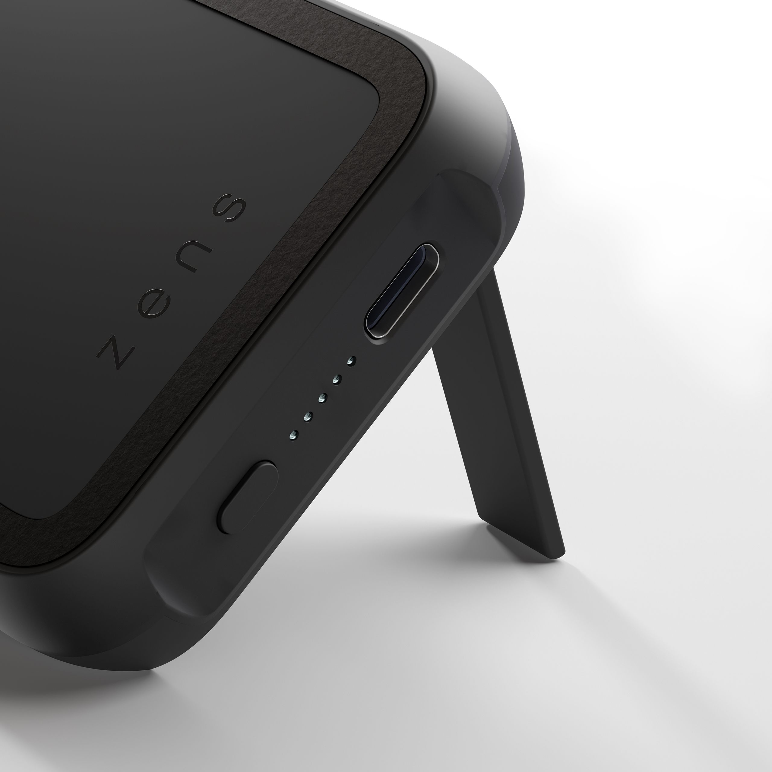 Schwarze Zens Powerbank mit Ständer. Die Powerbank hat einen USB-C-Anschluss und Ladelichter.