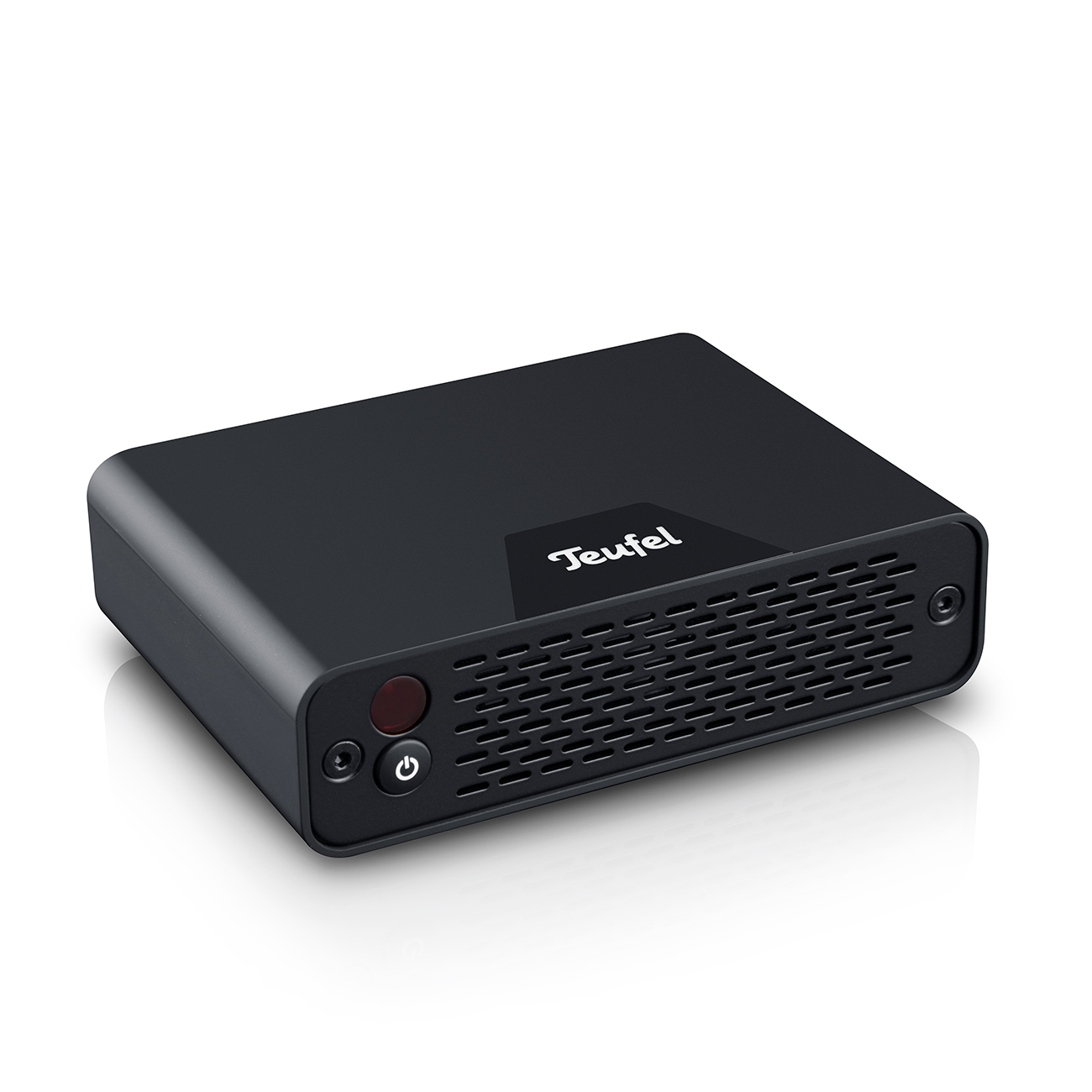 Un dispositivo audio Teufel rettangolare nero con pulsante di accensione e fessure.