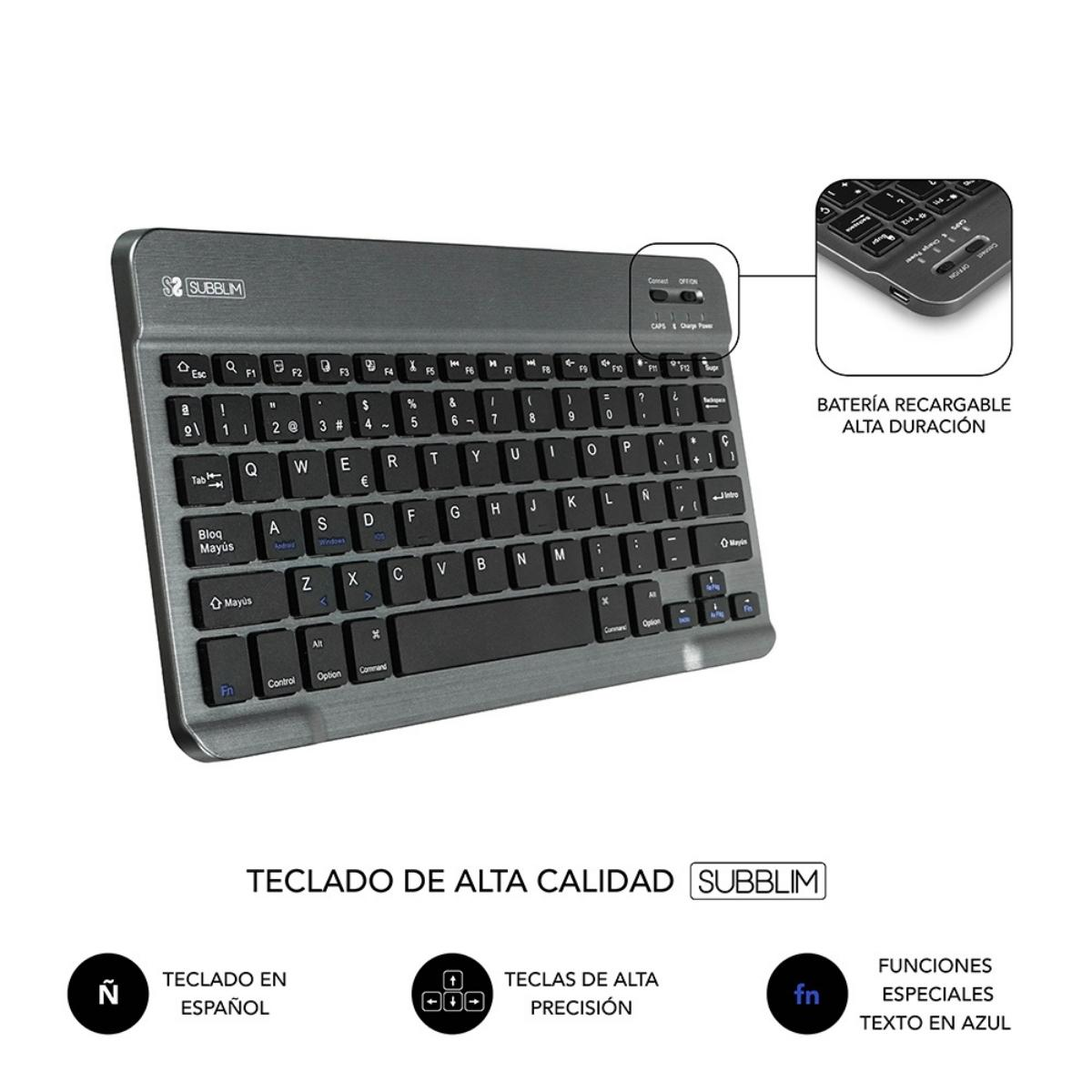 Teclado gris con marco plateado. Tiene un botón de encendido y está cerca de infografías.