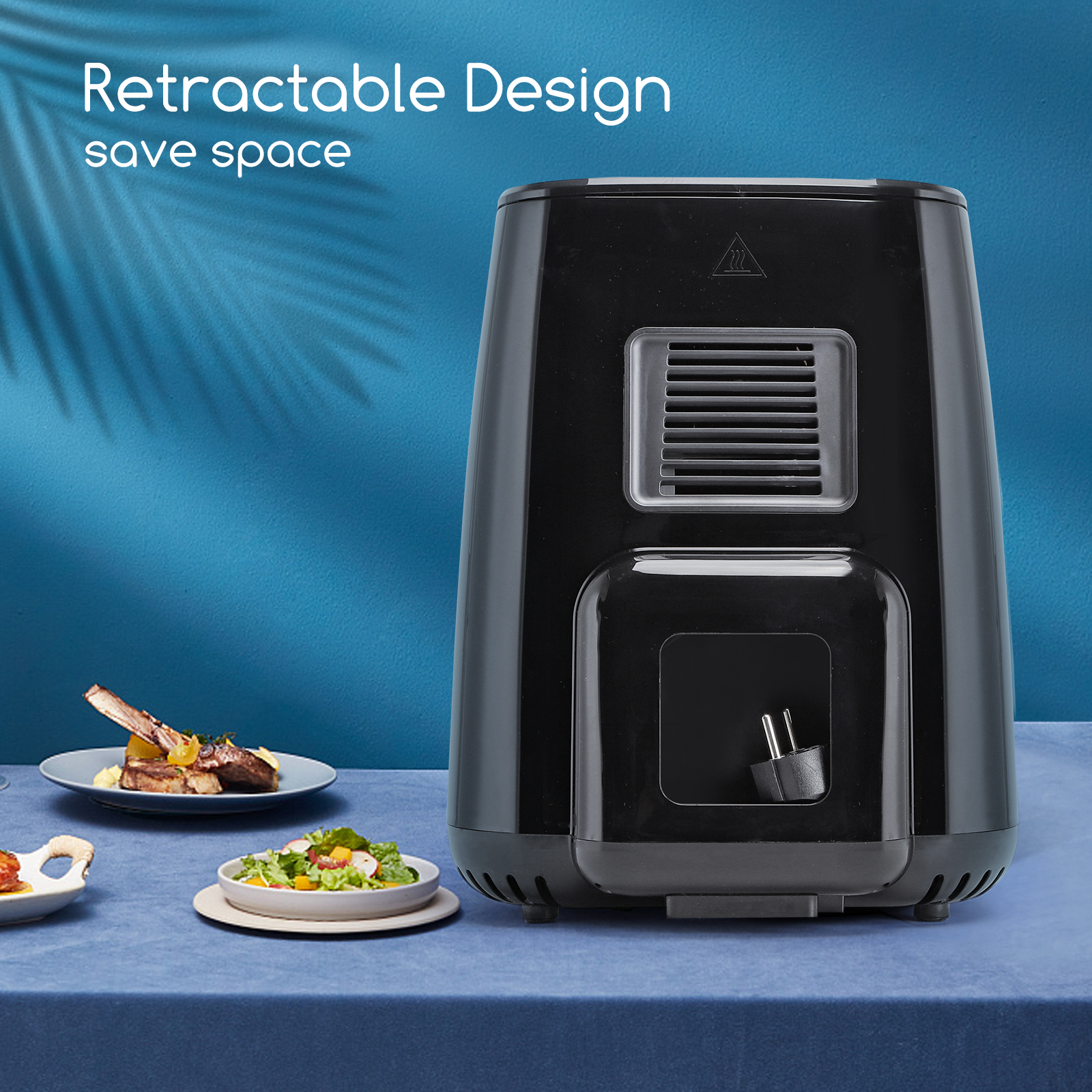 Freidora de aire negra con platos de comida sobre mesa azul, texto: Diseño retráctil ahorra espacio.